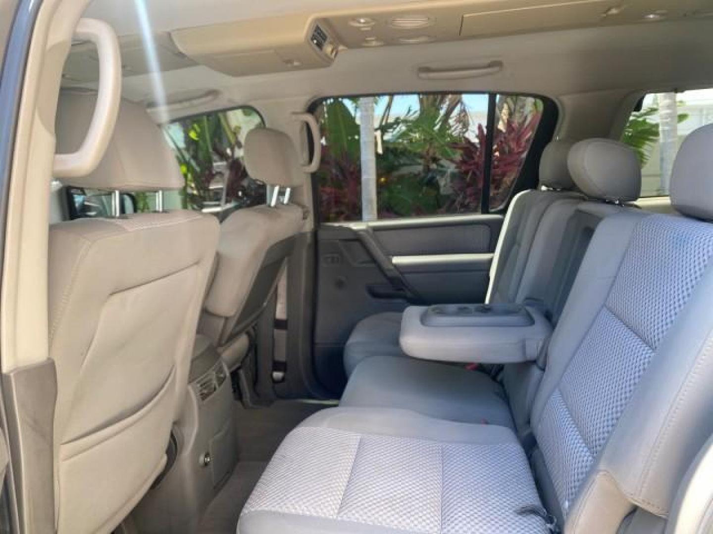 2006 Smoke Metallic /Graphite/Titanium Nissan Armada SE 21 SERVICES NO ACCIDENTS (5N1AA08A96N) with an 5.6L DOHC 32-Valve Endurance V8 Engine engine, Automatic transmission, located at 4701 North Dixie Hwy, Pompano Beach, FL, 33064, (954) 422-2889, 26.240938, -80.123474 - OUR WEBPAGE FLORIDACARS1.COM HAS OVER 100 PHOTOS AND FREE CARFAX LINK 2006 NISSAN ARMADA SE VIN: 5N1AA08A96N736506 5 N 1 A A 0 8 A 9 6 N 7 3 6 5 0 6 4 DOOR WAGON/SPORT UTILITY 5.6L V8 F DOHC 32V GASOLINE REAR WHEEL DRIVE Top Features Alloy Wheels Cloth Seats Fold-Away Third Row Parking Sensors Rear - Photo#66