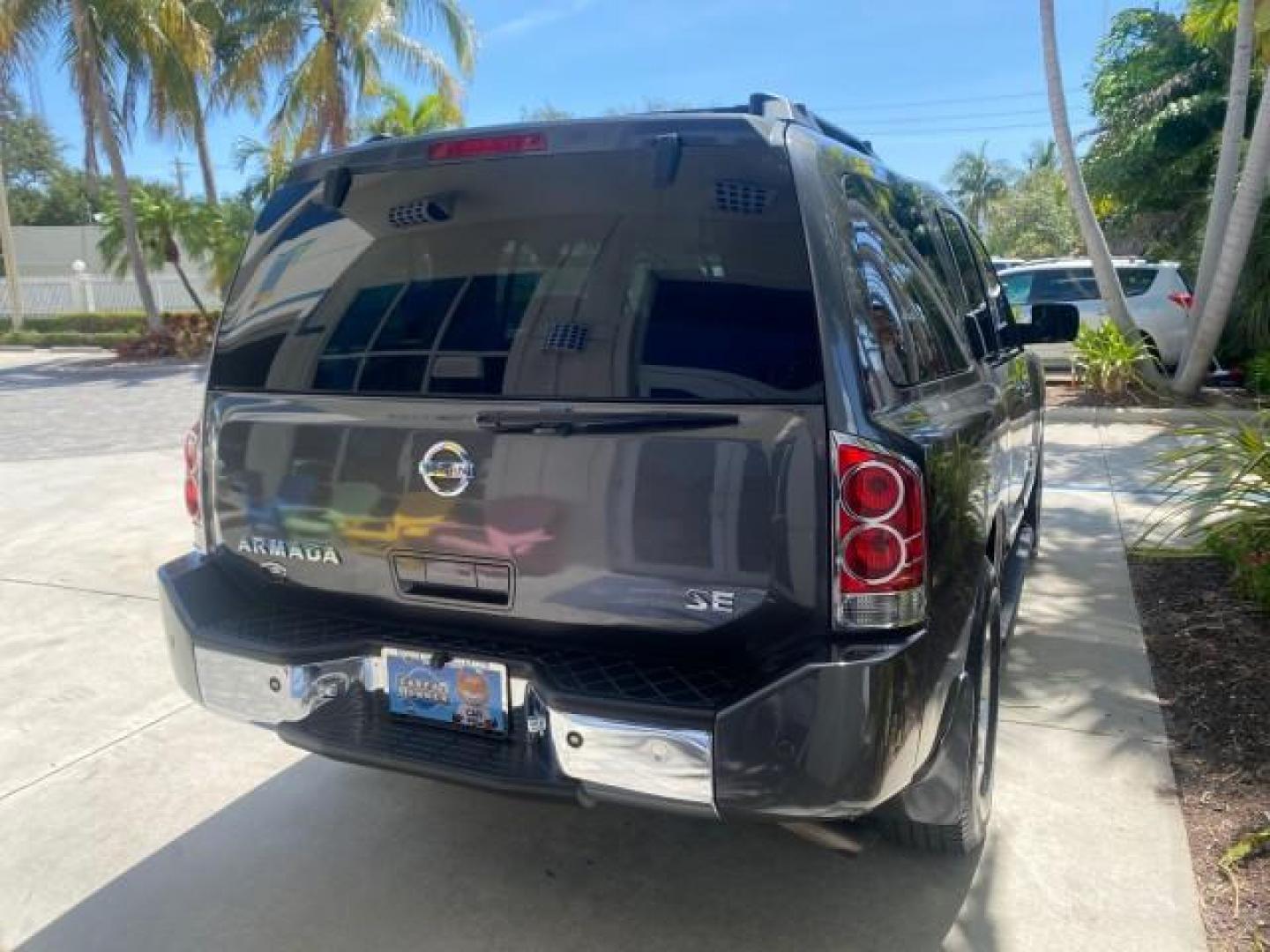 2006 Smoke Metallic /Graphite/Titanium Nissan Armada SE 21 SERVICES NO ACCIDENTS (5N1AA08A96N) with an 5.6L DOHC 32-Valve Endurance V8 Engine engine, Automatic transmission, located at 4701 North Dixie Hwy, Pompano Beach, FL, 33064, (954) 422-2889, 26.240938, -80.123474 - OUR WEBPAGE FLORIDACARS1.COM HAS OVER 100 PHOTOS AND FREE CARFAX LINK 2006 NISSAN ARMADA SE VIN: 5N1AA08A96N736506 5 N 1 A A 0 8 A 9 6 N 7 3 6 5 0 6 4 DOOR WAGON/SPORT UTILITY 5.6L V8 F DOHC 32V GASOLINE REAR WHEEL DRIVE Top Features Alloy Wheels Cloth Seats Fold-Away Third Row Parking Sensors Rear - Photo#84