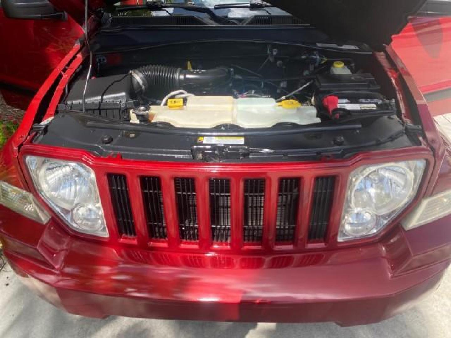 2010 Inferno Red Crystal Pearl /Dark slate gray Jeep Liberty Sport 1 OWNER LOW MILES 46,939 (1J4PP2GK4AW) with an 3.7L V6 Engine engine, Automatic transmission, located at 4701 North Dixie Hwy, Pompano Beach, FL, 33064, (954) 422-2889, 26.240938, -80.123474 - OUR WEBPAGE FLORIDACARS1.COM HAS OVER 100 PHOTOS AND FREE CARFAX LINK 2010 JEEP LIBERTY SPORT VIN: 1J4PP2GK4AW173185 1 J 4 P P 2 G K 4 A W 1 7 3 1 8 5 4 DOOR WAGON/SPORT UTILITY 3.7L V6 F SOHC 12V GASOLINE REAR WHEEL DRIVE Top Features Alloy Wheels Cloth Seats Running Boards Satellite Radio Ready To - Photo#17