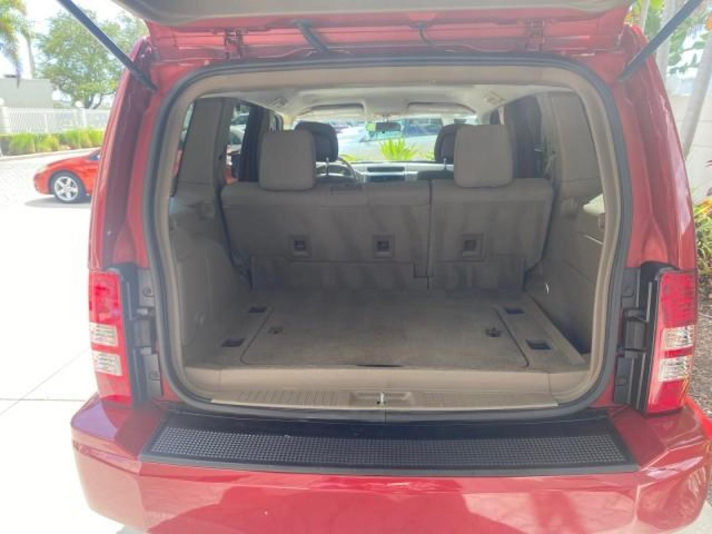 2010 Inferno Red Crystal Pearl /Dark slate gray Jeep Liberty Sport 1 OWNER LOW MILES 46,939 (1J4PP2GK4AW) with an 3.7L V6 Engine engine, Automatic transmission, located at 4701 North Dixie Hwy, Pompano Beach, FL, 33064, (954) 422-2889, 26.240938, -80.123474 - OUR WEBPAGE FLORIDACARS1.COM HAS OVER 100 PHOTOS AND FREE CARFAX LINK 2010 JEEP LIBERTY SPORT VIN: 1J4PP2GK4AW173185 1 J 4 P P 2 G K 4 A W 1 7 3 1 8 5 4 DOOR WAGON/SPORT UTILITY 3.7L V6 F SOHC 12V GASOLINE REAR WHEEL DRIVE Top Features Alloy Wheels Cloth Seats Running Boards Satellite Radio Ready To - Photo#75