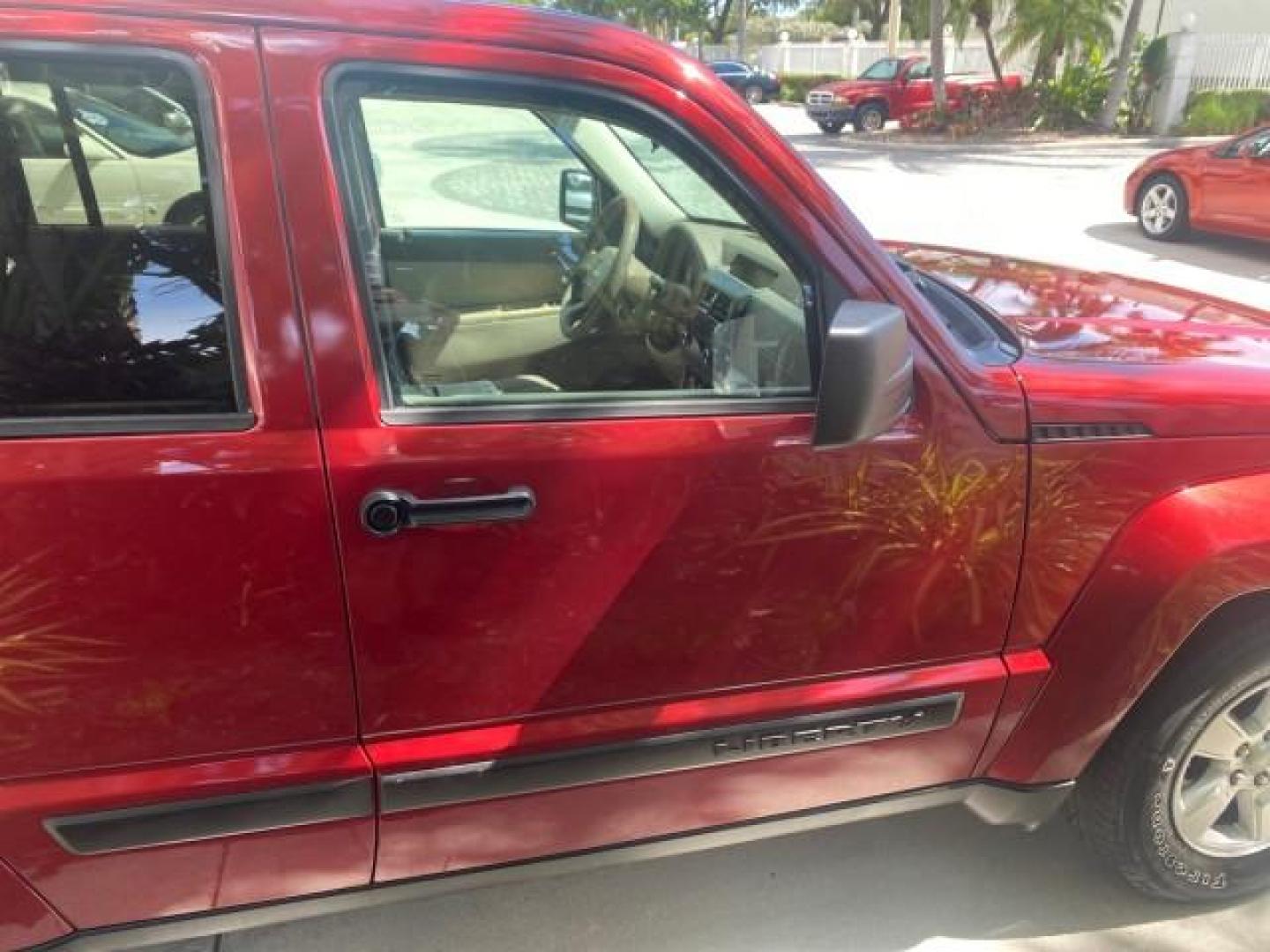 2010 Inferno Red Crystal Pearl /Dark slate gray Jeep Liberty Sport 1 OWNER LOW MILES 46,939 (1J4PP2GK4AW) with an 3.7L V6 Engine engine, Automatic transmission, located at 4701 North Dixie Hwy, Pompano Beach, FL, 33064, (954) 422-2889, 26.240938, -80.123474 - OUR WEBPAGE FLORIDACARS1.COM HAS OVER 100 PHOTOS AND FREE CARFAX LINK 2010 JEEP LIBERTY SPORT VIN: 1J4PP2GK4AW173185 1 J 4 P P 2 G K 4 A W 1 7 3 1 8 5 4 DOOR WAGON/SPORT UTILITY 3.7L V6 F SOHC 12V GASOLINE REAR WHEEL DRIVE Top Features Alloy Wheels Cloth Seats Running Boards Satellite Radio Ready To - Photo#88