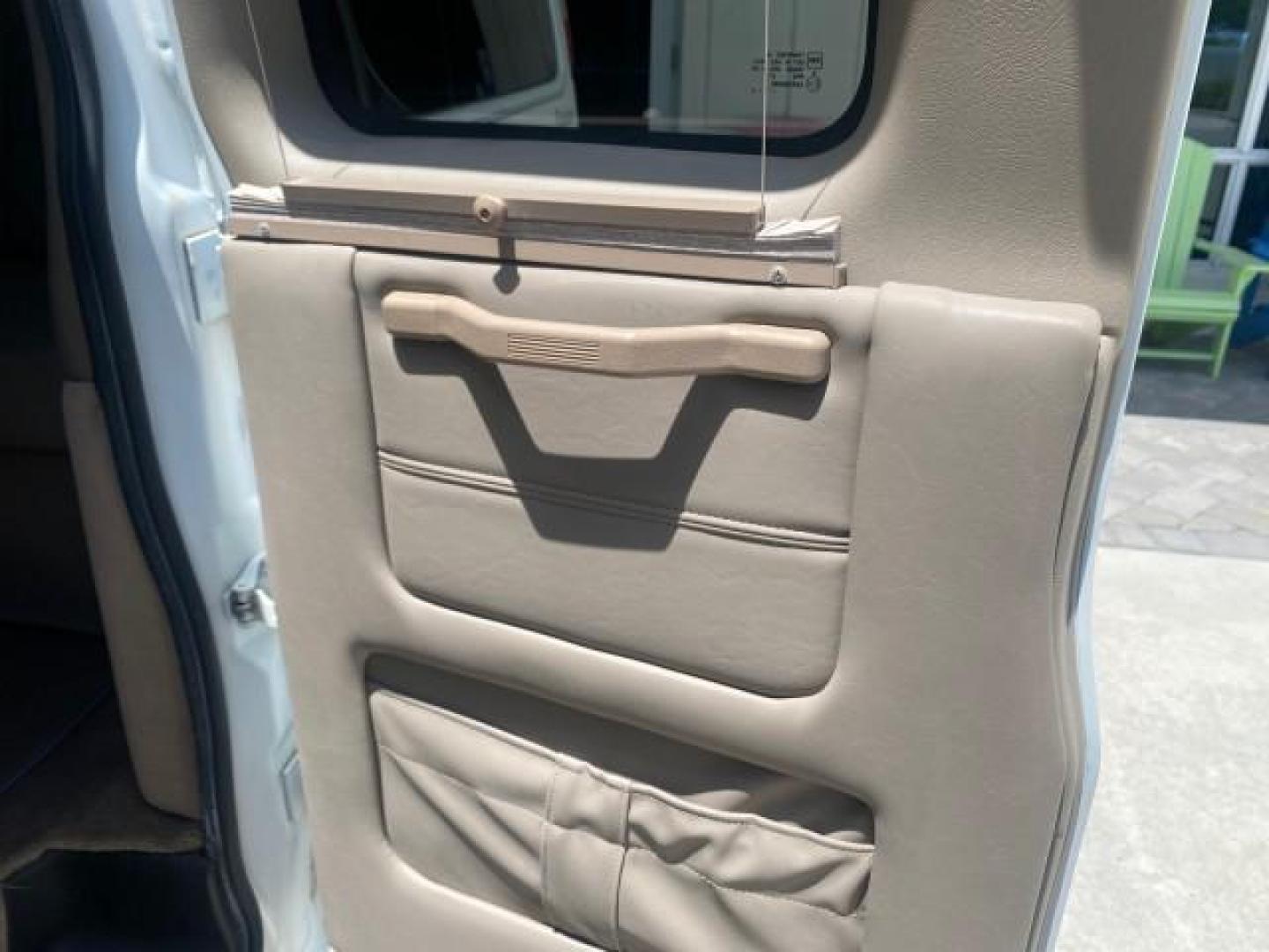 2003 Summit White /Medium Pewter Chevrolet Express HI TOP CONVERSION EXPLOR LOW MILES 55,452 (1GBFG15T331) with an 5.3L Vortec 5300 V8 SFI Engine engine, Automatic transmission, located at 4701 North Dixie Hwy, Pompano Beach, FL, 33064, (954) 422-2889, 26.240938, -80.123474 - OUR WEBPAGE FLORIDACARS1.COM HAS OVER 100 PHOTOS AND FREE CARFAX LINK OVER $ 90,000 NEW 2003 CHEVROLET EXPRESS G1500 LIMITED EXPLORER HI TOP CONVERSION VIN: 1GBFG15T331235672 1 G B F G 1 5 T 3 3 1 2 3 5 6 7 2 VAN 5.3L V8 F OHV GASOLINE REAR WHEEL DRIVE Top Features Alloy Wheels Conversion Van Fold-A - Photo#61