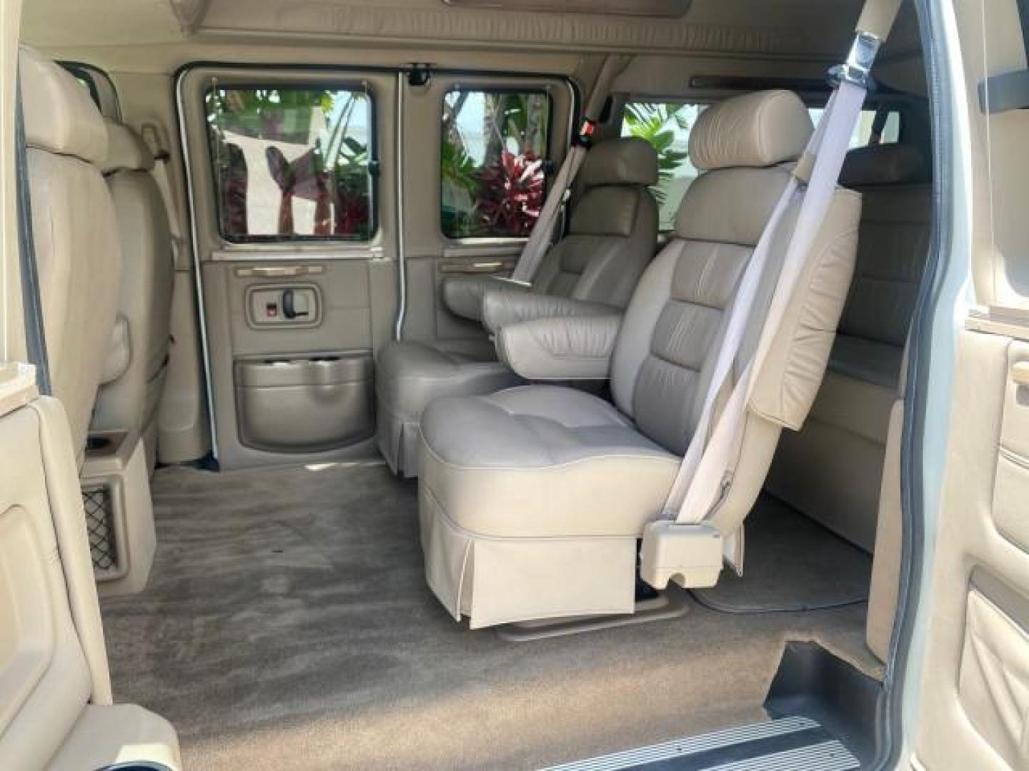 2003 Summit White /Medium Pewter Chevrolet Express HI TOP CONVERSION EXPLOR LOW MILES 55,452 (1GBFG15T331) with an 5.3L Vortec 5300 V8 SFI Engine engine, Automatic transmission, located at 4701 North Dixie Hwy, Pompano Beach, FL, 33064, (954) 422-2889, 26.240938, -80.123474 - OUR WEBPAGE FLORIDACARS1.COM HAS OVER 100 PHOTOS AND FREE CARFAX LINK OVER $ 90,000 NEW 2003 CHEVROLET EXPRESS G1500 LIMITED EXPLORER HI TOP CONVERSION VIN: 1GBFG15T331235672 1 G B F G 1 5 T 3 3 1 2 3 5 6 7 2 VAN 5.3L V8 F OHV GASOLINE REAR WHEEL DRIVE Top Features Alloy Wheels Conversion Van Fold-A - Photo#63