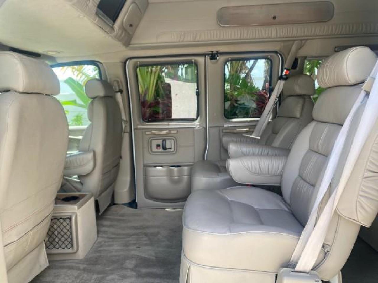 2003 Summit White /Medium Pewter Chevrolet Express HI TOP CONVERSION EXPLOR LOW MILES 55,452 (1GBFG15T331) with an 5.3L Vortec 5300 V8 SFI Engine engine, Automatic transmission, located at 4701 North Dixie Hwy, Pompano Beach, FL, 33064, (954) 422-2889, 26.240938, -80.123474 - OUR WEBPAGE FLORIDACARS1.COM HAS OVER 100 PHOTOS AND FREE CARFAX LINK OVER $ 90,000 NEW 2003 CHEVROLET EXPRESS G1500 LIMITED EXPLORER HI TOP CONVERSION VIN: 1GBFG15T331235672 1 G B F G 1 5 T 3 3 1 2 3 5 6 7 2 VAN 5.3L V8 F OHV GASOLINE REAR WHEEL DRIVE Top Features Alloy Wheels Conversion Van Fold-A - Photo#65