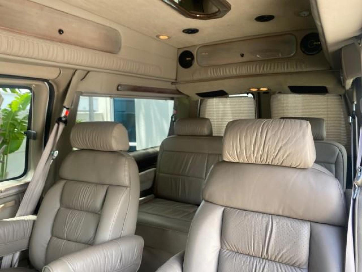 2003 Summit White /Medium Pewter Chevrolet Express HI TOP CONVERSION EXPLOR LOW MILES 55,452 (1GBFG15T331) with an 5.3L Vortec 5300 V8 SFI Engine engine, Automatic transmission, located at 4701 North Dixie Hwy, Pompano Beach, FL, 33064, (954) 422-2889, 26.240938, -80.123474 - OUR WEBPAGE FLORIDACARS1.COM HAS OVER 100 PHOTOS AND FREE CARFAX LINK OVER $ 90,000 NEW 2003 CHEVROLET EXPRESS G1500 LIMITED EXPLORER HI TOP CONVERSION VIN: 1GBFG15T331235672 1 G B F G 1 5 T 3 3 1 2 3 5 6 7 2 VAN 5.3L V8 F OHV GASOLINE REAR WHEEL DRIVE Top Features Alloy Wheels Conversion Van Fold-A - Photo#66