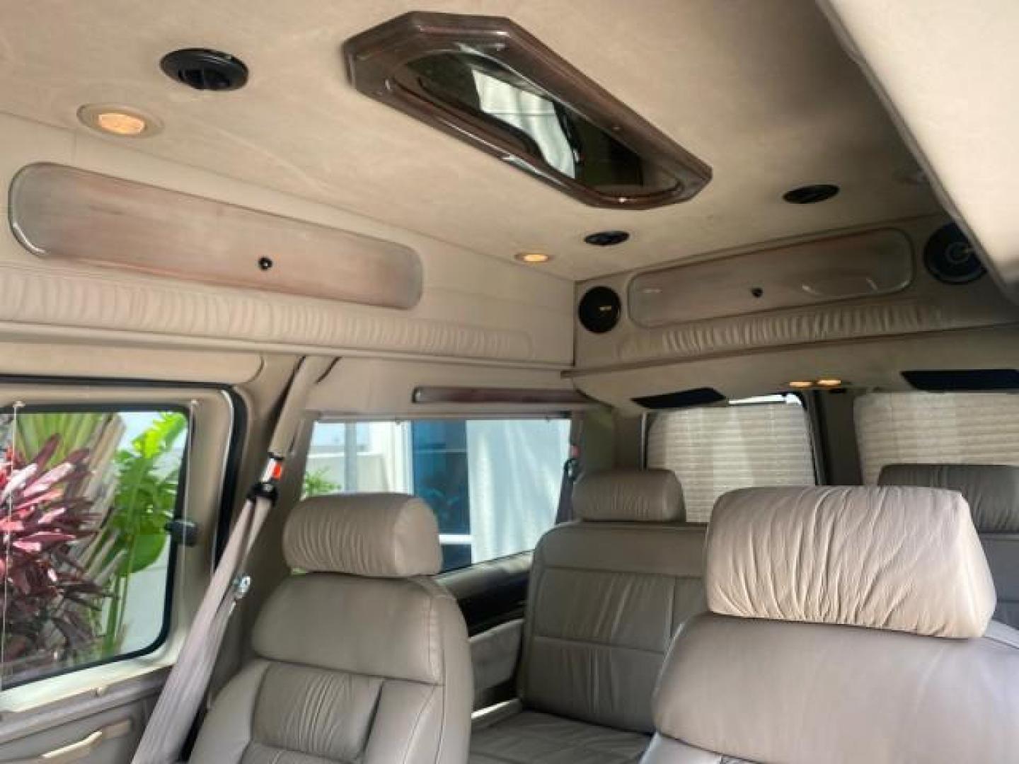 2003 Summit White /Medium Pewter Chevrolet Express HI TOP CONVERSION EXPLOR LOW MILES 55,452 (1GBFG15T331) with an 5.3L Vortec 5300 V8 SFI Engine engine, Automatic transmission, located at 4701 North Dixie Hwy, Pompano Beach, FL, 33064, (954) 422-2889, 26.240938, -80.123474 - OUR WEBPAGE FLORIDACARS1.COM HAS OVER 100 PHOTOS AND FREE CARFAX LINK OVER $ 90,000 NEW 2003 CHEVROLET EXPRESS G1500 LIMITED EXPLORER HI TOP CONVERSION VIN: 1GBFG15T331235672 1 G B F G 1 5 T 3 3 1 2 3 5 6 7 2 VAN 5.3L V8 F OHV GASOLINE REAR WHEEL DRIVE Top Features Alloy Wheels Conversion Van Fold-A - Photo#67