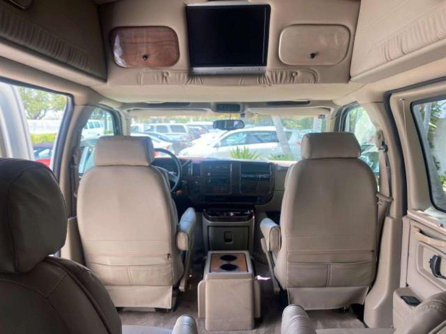 2003 Summit White /Medium Pewter Chevrolet Express HI TOP CONVERSION EXPLOR LOW MILES 55,452 (1GBFG15T331) with an 5.3L Vortec 5300 V8 SFI Engine engine, Automatic transmission, located at 4701 North Dixie Hwy, Pompano Beach, FL, 33064, (954) 422-2889, 26.240938, -80.123474 - OUR WEBPAGE FLORIDACARS1.COM HAS OVER 100 PHOTOS AND FREE CARFAX LINK OVER $ 90,000 NEW 2003 CHEVROLET EXPRESS G1500 LIMITED EXPLORER HI TOP CONVERSION VIN: 1GBFG15T331235672 1 G B F G 1 5 T 3 3 1 2 3 5 6 7 2 VAN 5.3L V8 F OHV GASOLINE REAR WHEEL DRIVE Top Features Alloy Wheels Conversion Van Fold-A - Photo#71