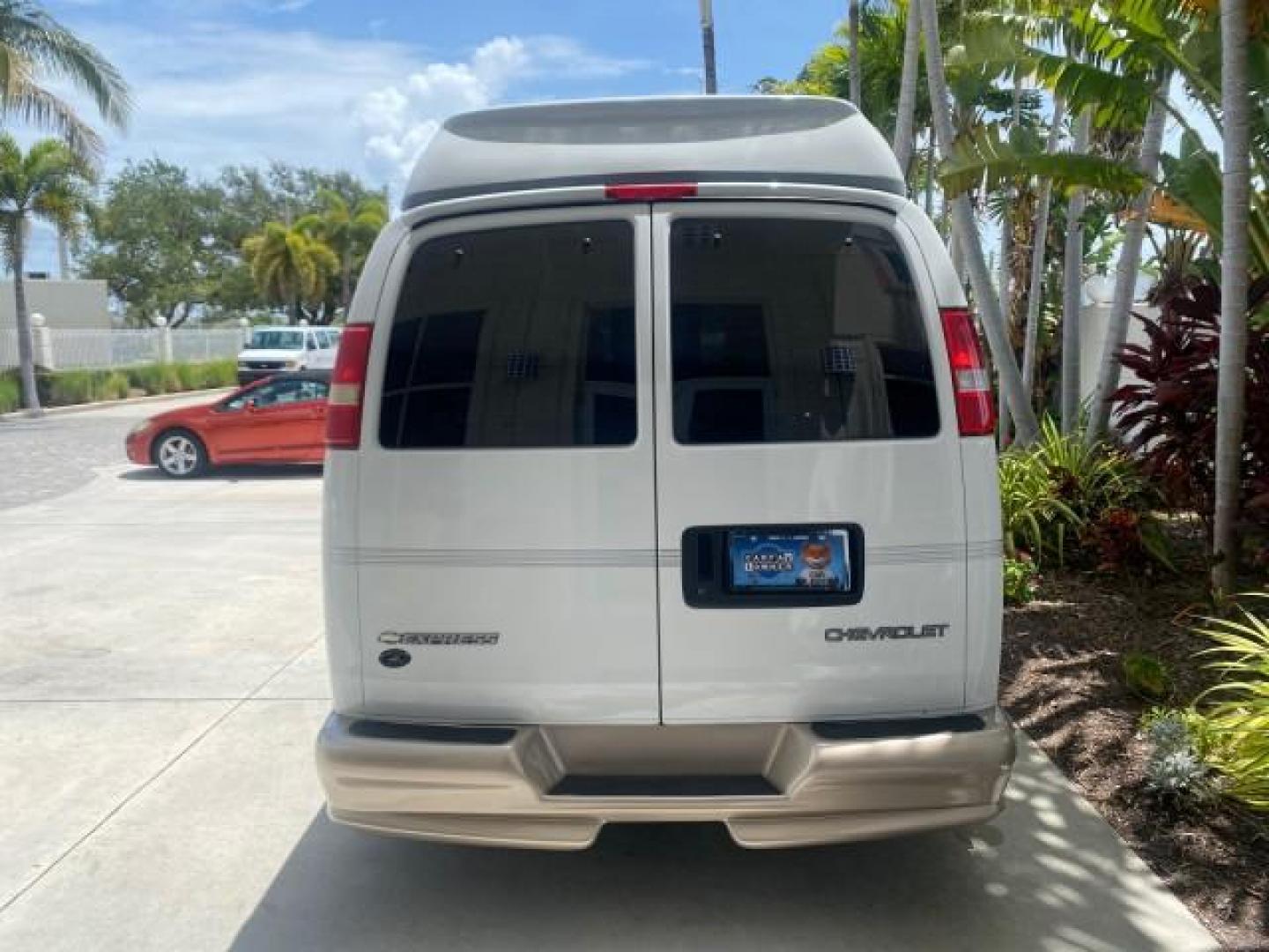 2003 Summit White /Medium Pewter Chevrolet Express HI TOP CONVERSION EXPLOR LOW MILES 55,452 (1GBFG15T331) with an 5.3L Vortec 5300 V8 SFI Engine engine, Automatic transmission, located at 4701 North Dixie Hwy, Pompano Beach, FL, 33064, (954) 422-2889, 26.240938, -80.123474 - OUR WEBPAGE FLORIDACARS1.COM HAS OVER 100 PHOTOS AND FREE CARFAX LINK OVER $ 90,000 NEW 2003 CHEVROLET EXPRESS G1500 LIMITED EXPLORER HI TOP CONVERSION VIN: 1GBFG15T331235672 1 G B F G 1 5 T 3 3 1 2 3 5 6 7 2 VAN 5.3L V8 F OHV GASOLINE REAR WHEEL DRIVE Top Features Alloy Wheels Conversion Van Fold-A - Photo#88