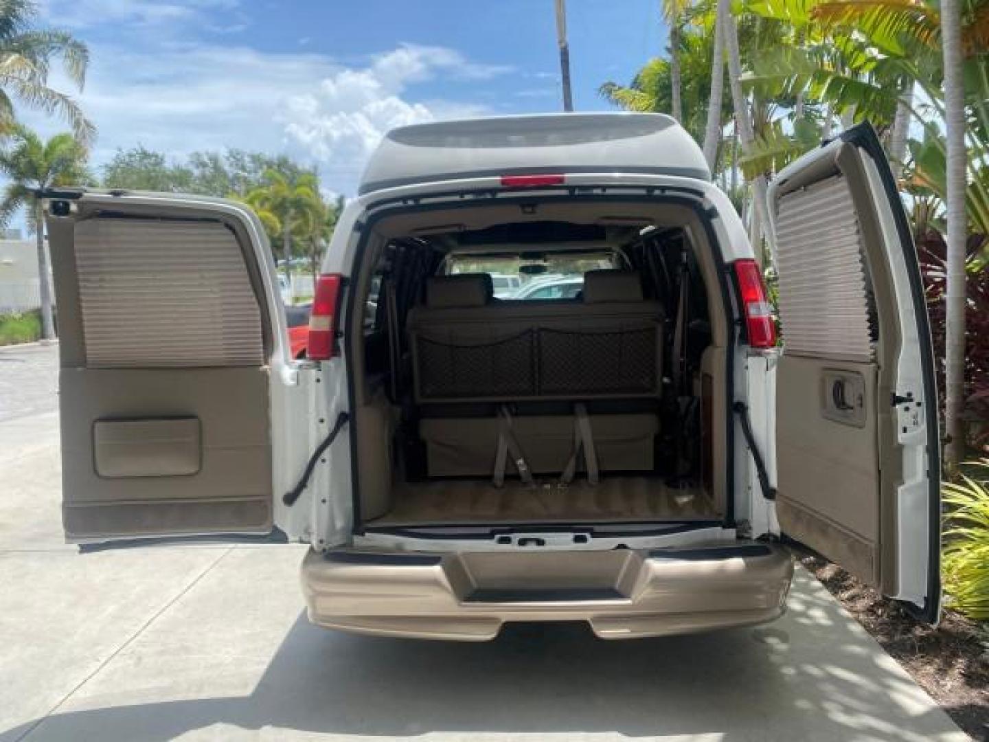 2003 Summit White /Medium Pewter Chevrolet Express HI TOP CONVERSION EXPLOR LOW MILES 55,452 (1GBFG15T331) with an 5.3L Vortec 5300 V8 SFI Engine engine, Automatic transmission, located at 4701 North Dixie Hwy, Pompano Beach, FL, 33064, (954) 422-2889, 26.240938, -80.123474 - OUR WEBPAGE FLORIDACARS1.COM HAS OVER 100 PHOTOS AND FREE CARFAX LINK OVER $ 90,000 NEW 2003 CHEVROLET EXPRESS G1500 LIMITED EXPLORER HI TOP CONVERSION VIN: 1GBFG15T331235672 1 G B F G 1 5 T 3 3 1 2 3 5 6 7 2 VAN 5.3L V8 F OHV GASOLINE REAR WHEEL DRIVE Top Features Alloy Wheels Conversion Van Fold-A - Photo#92