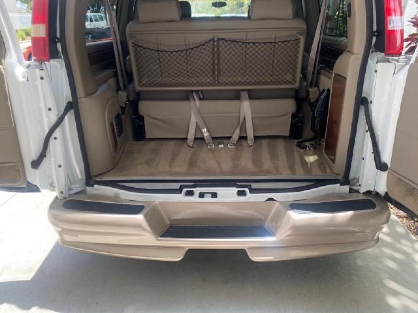 2003 Summit White /Medium Pewter Chevrolet Express HI TOP CONVERSION EXPLOR LOW MILES 55,452 (1GBFG15T331) with an 5.3L Vortec 5300 V8 SFI Engine engine, Automatic transmission, located at 4701 North Dixie Hwy, Pompano Beach, FL, 33064, (954) 422-2889, 26.240938, -80.123474 - OUR WEBPAGE FLORIDACARS1.COM HAS OVER 100 PHOTOS AND FREE CARFAX LINK OVER $ 90,000 NEW 2003 CHEVROLET EXPRESS G1500 LIMITED EXPLORER HI TOP CONVERSION VIN: 1GBFG15T331235672 1 G B F G 1 5 T 3 3 1 2 3 5 6 7 2 VAN 5.3L V8 F OHV GASOLINE REAR WHEEL DRIVE Top Features Alloy Wheels Conversion Van Fold-A - Photo#93