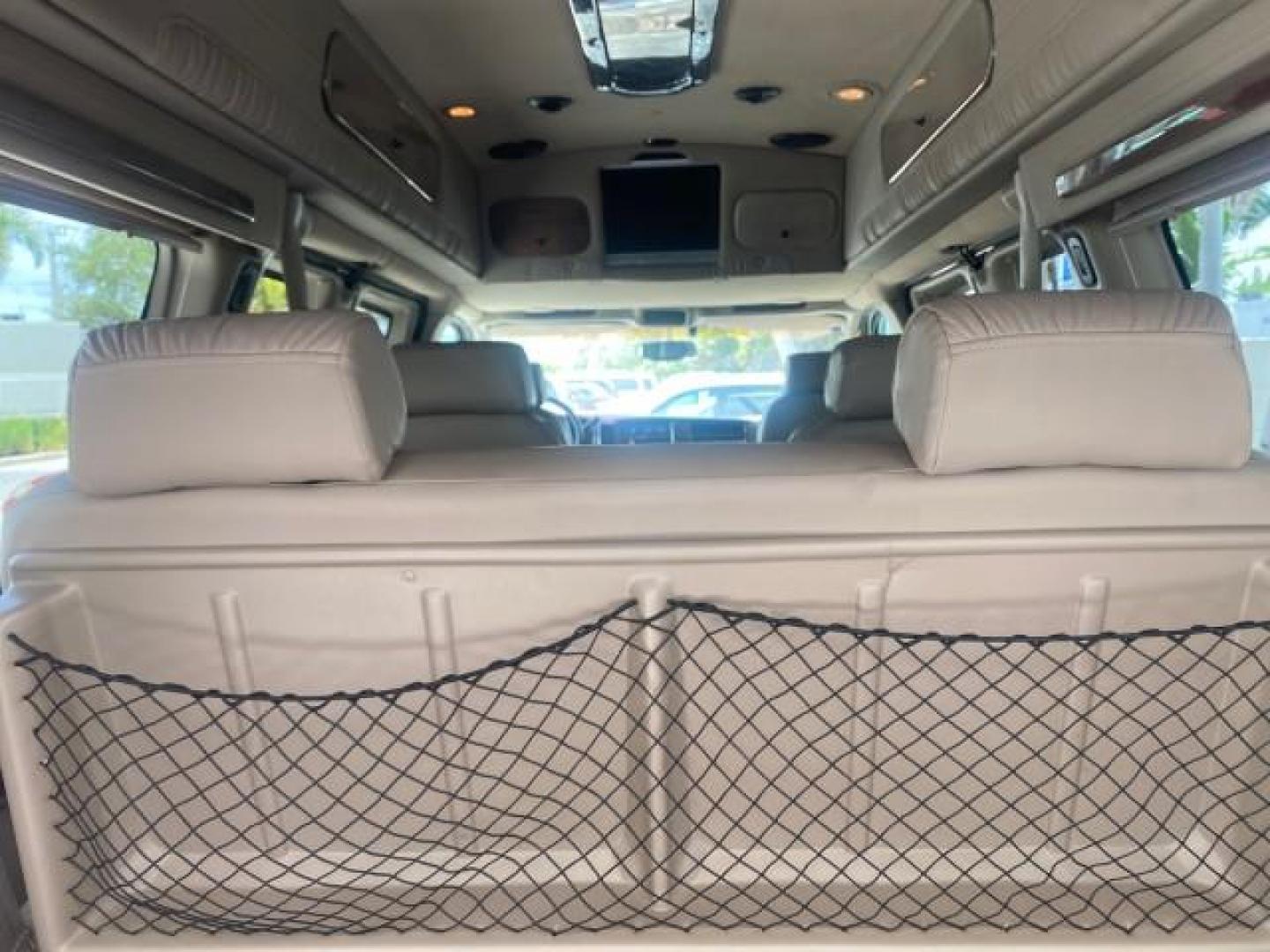 2003 Summit White /Medium Pewter Chevrolet Express HI TOP CONVERSION EXPLOR LOW MILES 55,452 (1GBFG15T331) with an 5.3L Vortec 5300 V8 SFI Engine engine, Automatic transmission, located at 4701 North Dixie Hwy, Pompano Beach, FL, 33064, (954) 422-2889, 26.240938, -80.123474 - OUR WEBPAGE FLORIDACARS1.COM HAS OVER 100 PHOTOS AND FREE CARFAX LINK OVER $ 90,000 NEW 2003 CHEVROLET EXPRESS G1500 LIMITED EXPLORER HI TOP CONVERSION VIN: 1GBFG15T331235672 1 G B F G 1 5 T 3 3 1 2 3 5 6 7 2 VAN 5.3L V8 F OHV GASOLINE REAR WHEEL DRIVE Top Features Alloy Wheels Conversion Van Fold-A - Photo#95