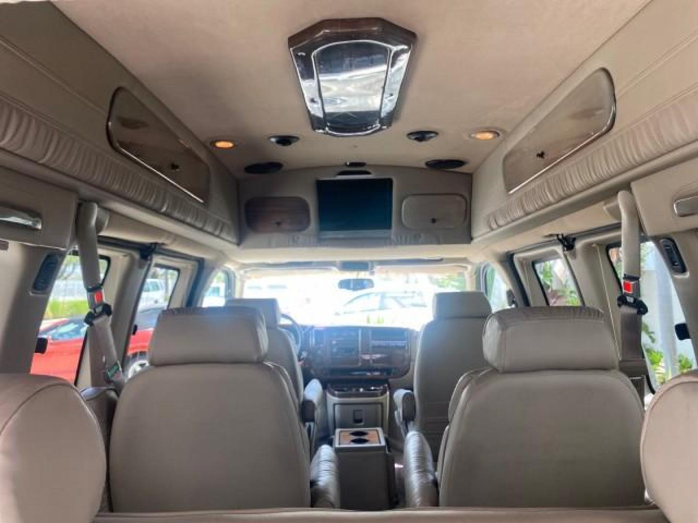 2003 Summit White /Medium Pewter Chevrolet Express HI TOP CONVERSION EXPLOR LOW MILES 55,452 (1GBFG15T331) with an 5.3L Vortec 5300 V8 SFI Engine engine, Automatic transmission, located at 4701 North Dixie Hwy, Pompano Beach, FL, 33064, (954) 422-2889, 26.240938, -80.123474 - OUR WEBPAGE FLORIDACARS1.COM HAS OVER 100 PHOTOS AND FREE CARFAX LINK OVER $ 90,000 NEW 2003 CHEVROLET EXPRESS G1500 LIMITED EXPLORER HI TOP CONVERSION VIN: 1GBFG15T331235672 1 G B F G 1 5 T 3 3 1 2 3 5 6 7 2 VAN 5.3L V8 F OHV GASOLINE REAR WHEEL DRIVE Top Features Alloy Wheels Conversion Van Fold-A - Photo#96