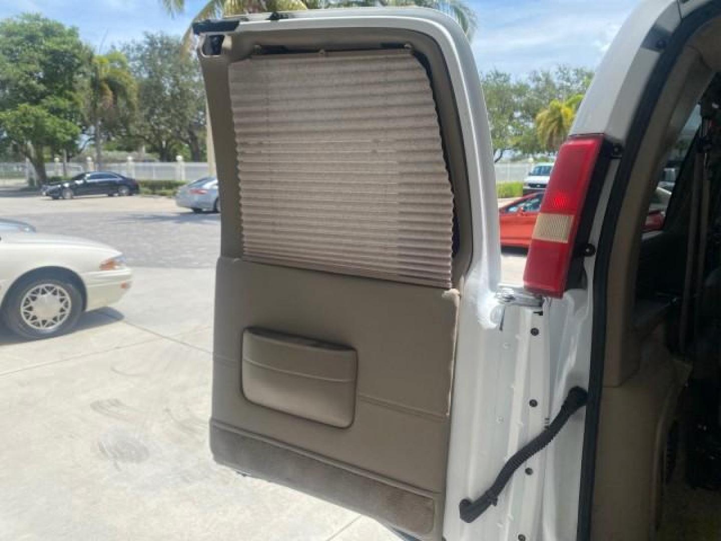 2003 Summit White /Medium Pewter Chevrolet Express HI TOP CONVERSION EXPLOR LOW MILES 55,452 (1GBFG15T331) with an 5.3L Vortec 5300 V8 SFI Engine engine, Automatic transmission, located at 4701 North Dixie Hwy, Pompano Beach, FL, 33064, (954) 422-2889, 26.240938, -80.123474 - OUR WEBPAGE FLORIDACARS1.COM HAS OVER 100 PHOTOS AND FREE CARFAX LINK OVER $ 90,000 NEW 2003 CHEVROLET EXPRESS G1500 LIMITED EXPLORER HI TOP CONVERSION VIN: 1GBFG15T331235672 1 G B F G 1 5 T 3 3 1 2 3 5 6 7 2 VAN 5.3L V8 F OHV GASOLINE REAR WHEEL DRIVE Top Features Alloy Wheels Conversion Van Fold-A - Photo#99