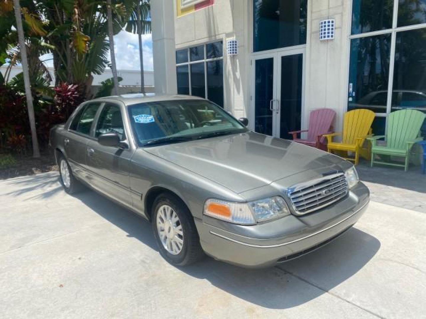 2004 Medium Titanium Metallic /Light Flint Ford Crown Victoria LX Sport LOW MILES 75,511 FL (2FAFP74W24X) with an 4.6L SEFI OHC V8 Engine engine, Automatic transmission, located at 4701 North Dixie Hwy, Pompano Beach, FL, 33064, (954) 422-2889, 26.240938, -80.123474 - OUR WEBPAGE FLORIDACARS1.COM HAS OVER 100 PHOTOS AND FREE CARFAX LINK 2004 FORD CROWN VICTORIA LX DUAL EXHAUST RARE FIND VIN: 2FAFP74W24X150704 2 F A F P 7 4 W 2 4 X 1 5 0 7 0 4 SEDAN 4 DR 4.6L V8 F GASOLINE REAR WHEEL DRIVE Top Features Alloy Wheels Leather Seats Basic Features ABS Brakes AM/FM Ste - Photo#1