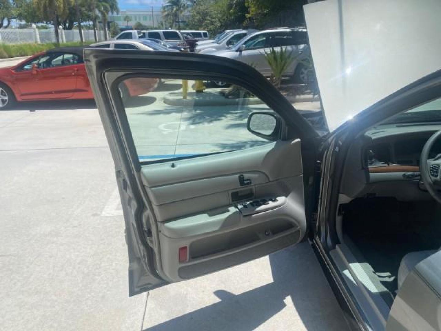 2004 Medium Titanium Metallic /Light Flint Ford Crown Victoria LX Sport LOW MILES 75,511 FL (2FAFP74W24X) with an 4.6L SEFI OHC V8 Engine engine, Automatic transmission, located at 4701 North Dixie Hwy, Pompano Beach, FL, 33064, (954) 422-2889, 26.240938, -80.123474 - OUR WEBPAGE FLORIDACARS1.COM HAS OVER 100 PHOTOS AND FREE CARFAX LINK 2004 FORD CROWN VICTORIA LX DUAL EXHAUST RARE FIND VIN: 2FAFP74W24X150704 2 F A F P 7 4 W 2 4 X 1 5 0 7 0 4 SEDAN 4 DR 4.6L V8 F GASOLINE REAR WHEEL DRIVE Top Features Alloy Wheels Leather Seats Basic Features ABS Brakes AM/FM Ste - Photo#9