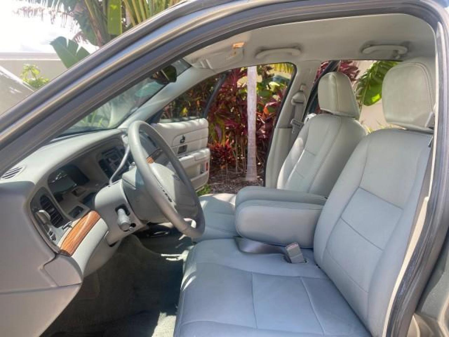 2004 Medium Titanium Metallic /Light Flint Ford Crown Victoria LX Sport LOW MILES 75,511 FL (2FAFP74W24X) with an 4.6L SEFI OHC V8 Engine engine, Automatic transmission, located at 4701 North Dixie Hwy, Pompano Beach, FL, 33064, (954) 422-2889, 26.240938, -80.123474 - OUR WEBPAGE FLORIDACARS1.COM HAS OVER 100 PHOTOS AND FREE CARFAX LINK 2004 FORD CROWN VICTORIA LX DUAL EXHAUST RARE FIND VIN: 2FAFP74W24X150704 2 F A F P 7 4 W 2 4 X 1 5 0 7 0 4 SEDAN 4 DR 4.6L V8 F GASOLINE REAR WHEEL DRIVE Top Features Alloy Wheels Leather Seats Basic Features ABS Brakes AM/FM Ste - Photo#10