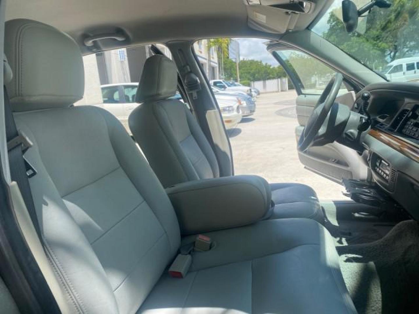 2004 Medium Titanium Metallic /Light Flint Ford Crown Victoria LX Sport LOW MILES 75,511 FL (2FAFP74W24X) with an 4.6L SEFI OHC V8 Engine engine, Automatic transmission, located at 4701 North Dixie Hwy, Pompano Beach, FL, 33064, (954) 422-2889, 26.240938, -80.123474 - OUR WEBPAGE FLORIDACARS1.COM HAS OVER 100 PHOTOS AND FREE CARFAX LINK 2004 FORD CROWN VICTORIA LX DUAL EXHAUST RARE FIND VIN: 2FAFP74W24X150704 2 F A F P 7 4 W 2 4 X 1 5 0 7 0 4 SEDAN 4 DR 4.6L V8 F GASOLINE REAR WHEEL DRIVE Top Features Alloy Wheels Leather Seats Basic Features ABS Brakes AM/FM Ste - Photo#12