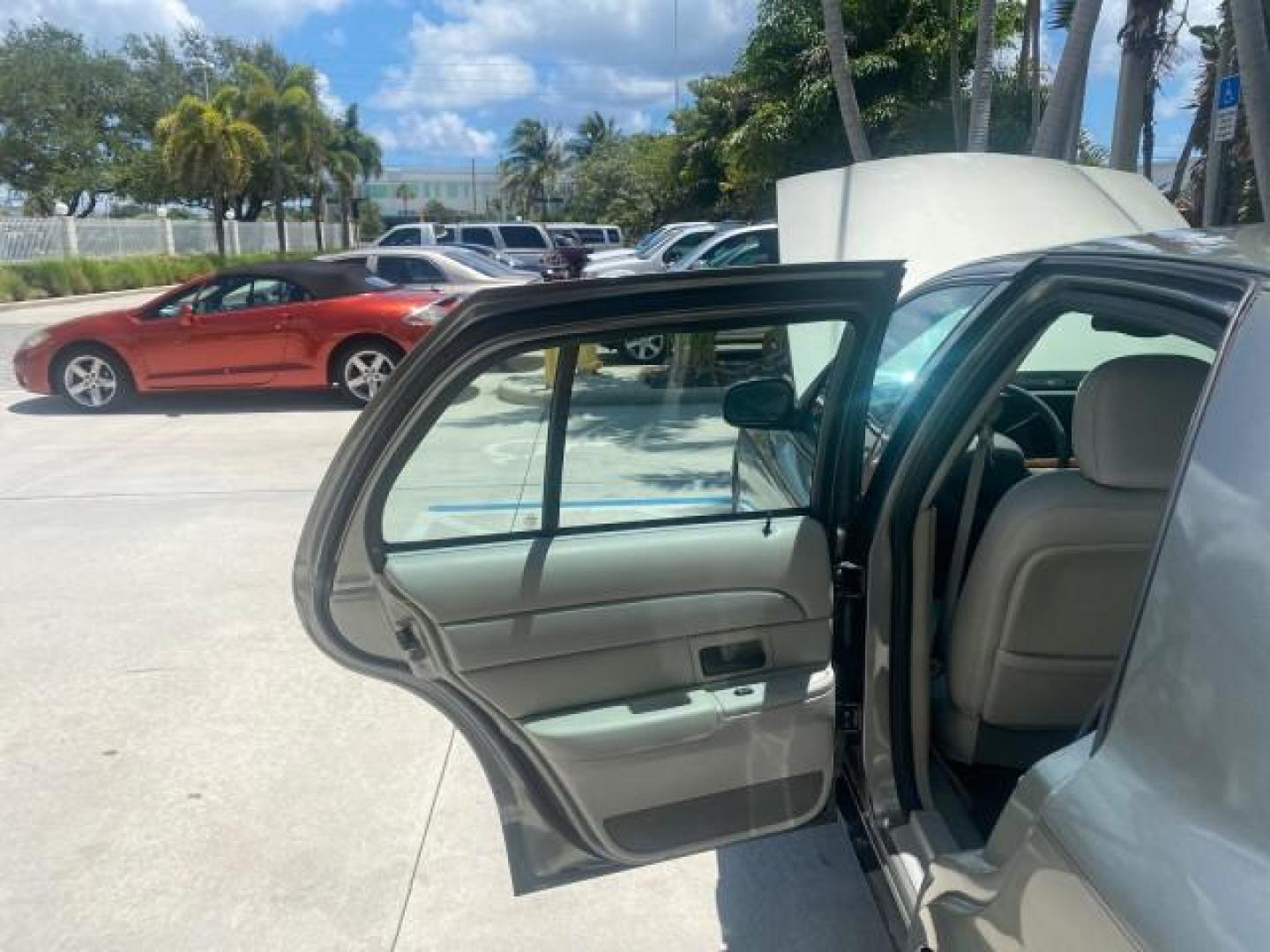 2004 Medium Titanium Metallic /Light Flint Ford Crown Victoria LX Sport LOW MILES 75,511 FL (2FAFP74W24X) with an 4.6L SEFI OHC V8 Engine engine, Automatic transmission, located at 4701 North Dixie Hwy, Pompano Beach, FL, 33064, (954) 422-2889, 26.240938, -80.123474 - OUR WEBPAGE FLORIDACARS1.COM HAS OVER 100 PHOTOS AND FREE CARFAX LINK 2004 FORD CROWN VICTORIA LX DUAL EXHAUST RARE FIND VIN: 2FAFP74W24X150704 2 F A F P 7 4 W 2 4 X 1 5 0 7 0 4 SEDAN 4 DR 4.6L V8 F GASOLINE REAR WHEEL DRIVE Top Features Alloy Wheels Leather Seats Basic Features ABS Brakes AM/FM Ste - Photo#13