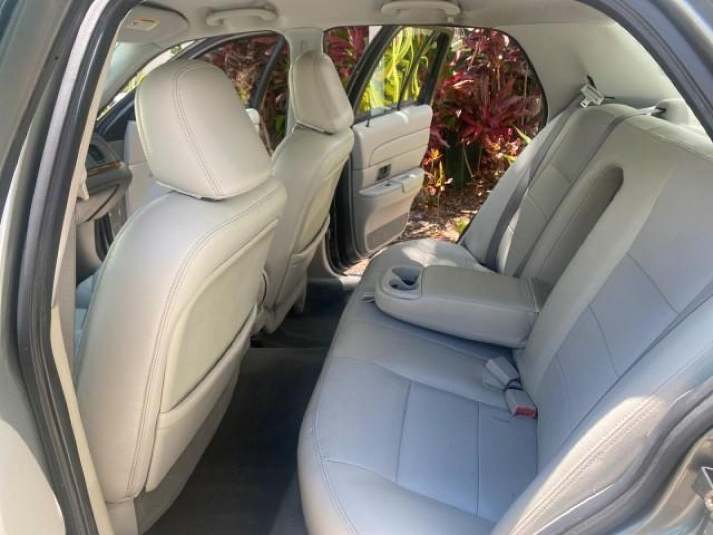 2004 Medium Titanium Metallic /Light Flint Ford Crown Victoria LX Sport LOW MILES 75,511 FL (2FAFP74W24X) with an 4.6L SEFI OHC V8 Engine engine, Automatic transmission, located at 4701 North Dixie Hwy, Pompano Beach, FL, 33064, (954) 422-2889, 26.240938, -80.123474 - OUR WEBPAGE FLORIDACARS1.COM HAS OVER 100 PHOTOS AND FREE CARFAX LINK 2004 FORD CROWN VICTORIA LX DUAL EXHAUST RARE FIND VIN: 2FAFP74W24X150704 2 F A F P 7 4 W 2 4 X 1 5 0 7 0 4 SEDAN 4 DR 4.6L V8 F GASOLINE REAR WHEEL DRIVE Top Features Alloy Wheels Leather Seats Basic Features ABS Brakes AM/FM Ste - Photo#14