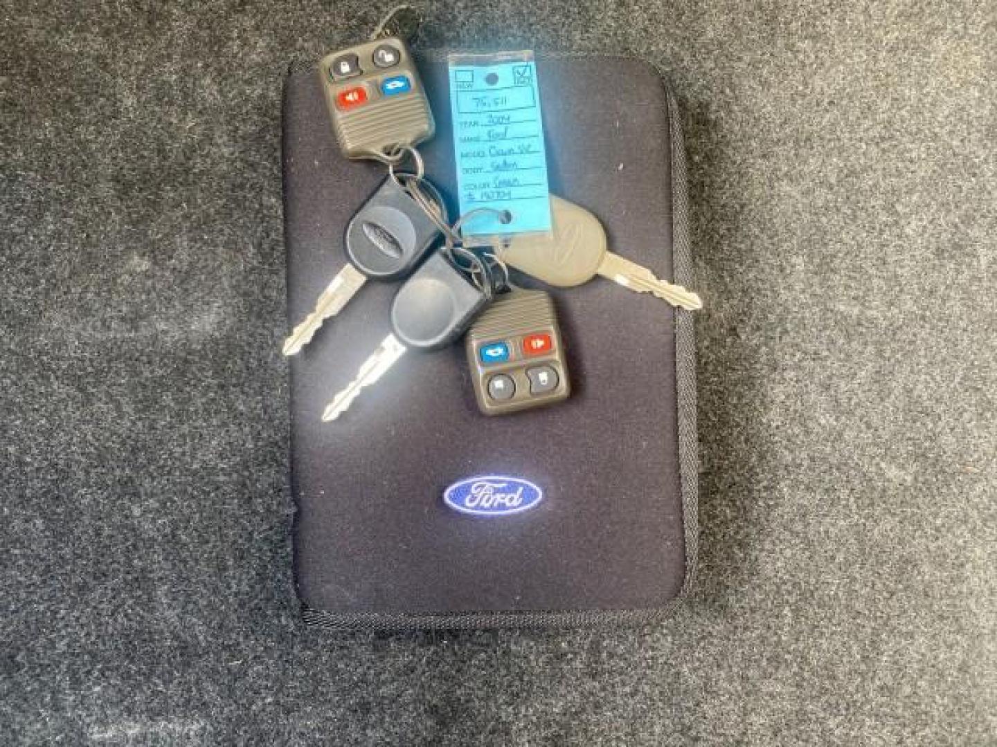 2004 Medium Titanium Metallic /Light Flint Ford Crown Victoria LX Sport LOW MILES 75,511 FL (2FAFP74W24X) with an 4.6L SEFI OHC V8 Engine engine, Automatic transmission, located at 4701 North Dixie Hwy, Pompano Beach, FL, 33064, (954) 422-2889, 26.240938, -80.123474 - OUR WEBPAGE FLORIDACARS1.COM HAS OVER 100 PHOTOS AND FREE CARFAX LINK 2004 FORD CROWN VICTORIA LX DUAL EXHAUST RARE FIND VIN: 2FAFP74W24X150704 2 F A F P 7 4 W 2 4 X 1 5 0 7 0 4 SEDAN 4 DR 4.6L V8 F GASOLINE REAR WHEEL DRIVE Top Features Alloy Wheels Leather Seats Basic Features ABS Brakes AM/FM Ste - Photo#23