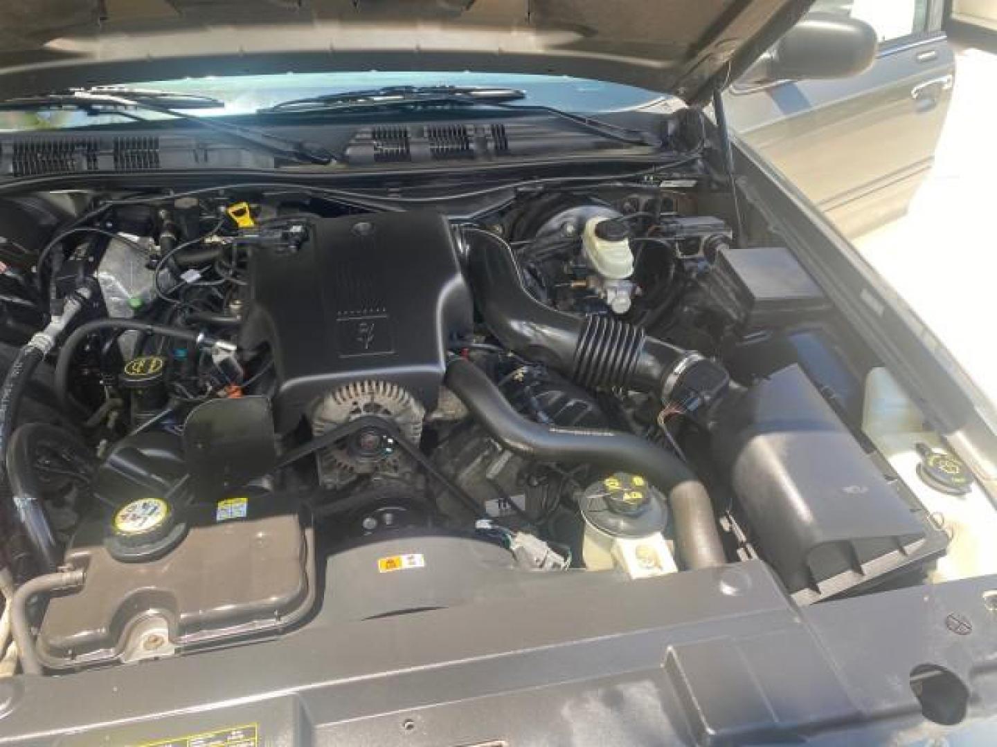 2004 Medium Titanium Metallic /Light Flint Ford Crown Victoria LX Sport LOW MILES 75,511 FL (2FAFP74W24X) with an 4.6L SEFI OHC V8 Engine engine, Automatic transmission, located at 4701 North Dixie Hwy, Pompano Beach, FL, 33064, (954) 422-2889, 26.240938, -80.123474 - OUR WEBPAGE FLORIDACARS1.COM HAS OVER 100 PHOTOS AND FREE CARFAX LINK 2004 FORD CROWN VICTORIA LX DUAL EXHAUST RARE FIND VIN: 2FAFP74W24X150704 2 F A F P 7 4 W 2 4 X 1 5 0 7 0 4 SEDAN 4 DR 4.6L V8 F GASOLINE REAR WHEEL DRIVE Top Features Alloy Wheels Leather Seats Basic Features ABS Brakes AM/FM Ste - Photo#26