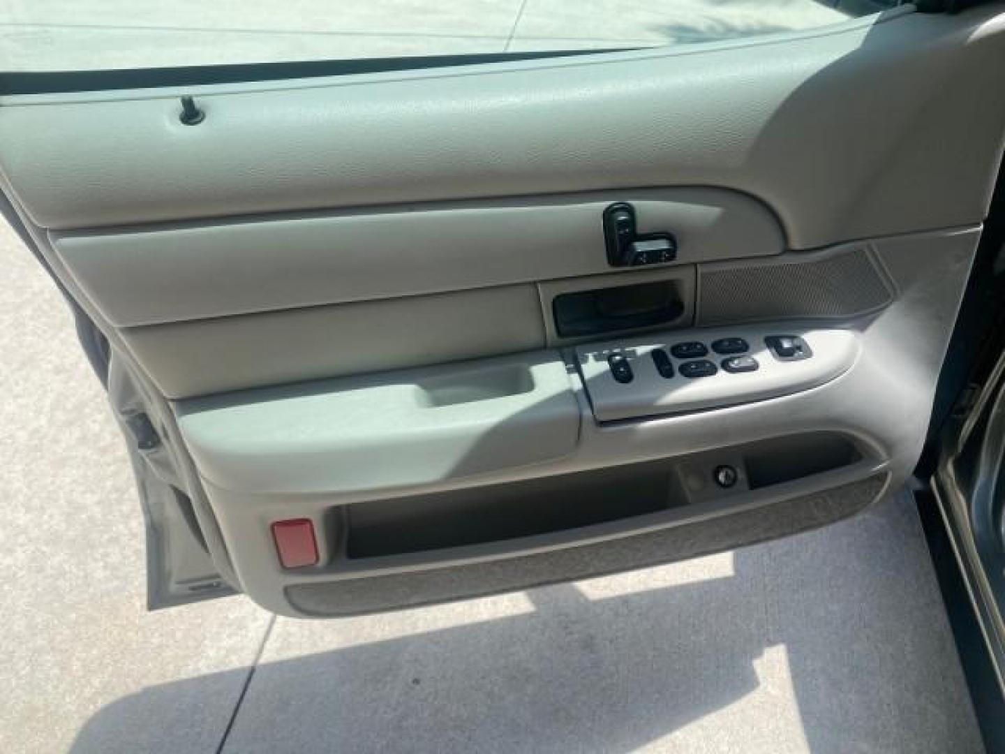 2004 Medium Titanium Metallic /Light Flint Ford Crown Victoria LX Sport LOW MILES 75,511 FL (2FAFP74W24X) with an 4.6L SEFI OHC V8 Engine engine, Automatic transmission, located at 4701 North Dixie Hwy, Pompano Beach, FL, 33064, (954) 422-2889, 26.240938, -80.123474 - OUR WEBPAGE FLORIDACARS1.COM HAS OVER 100 PHOTOS AND FREE CARFAX LINK 2004 FORD CROWN VICTORIA LX DUAL EXHAUST RARE FIND VIN: 2FAFP74W24X150704 2 F A F P 7 4 W 2 4 X 1 5 0 7 0 4 SEDAN 4 DR 4.6L V8 F GASOLINE REAR WHEEL DRIVE Top Features Alloy Wheels Leather Seats Basic Features ABS Brakes AM/FM Ste - Photo#31