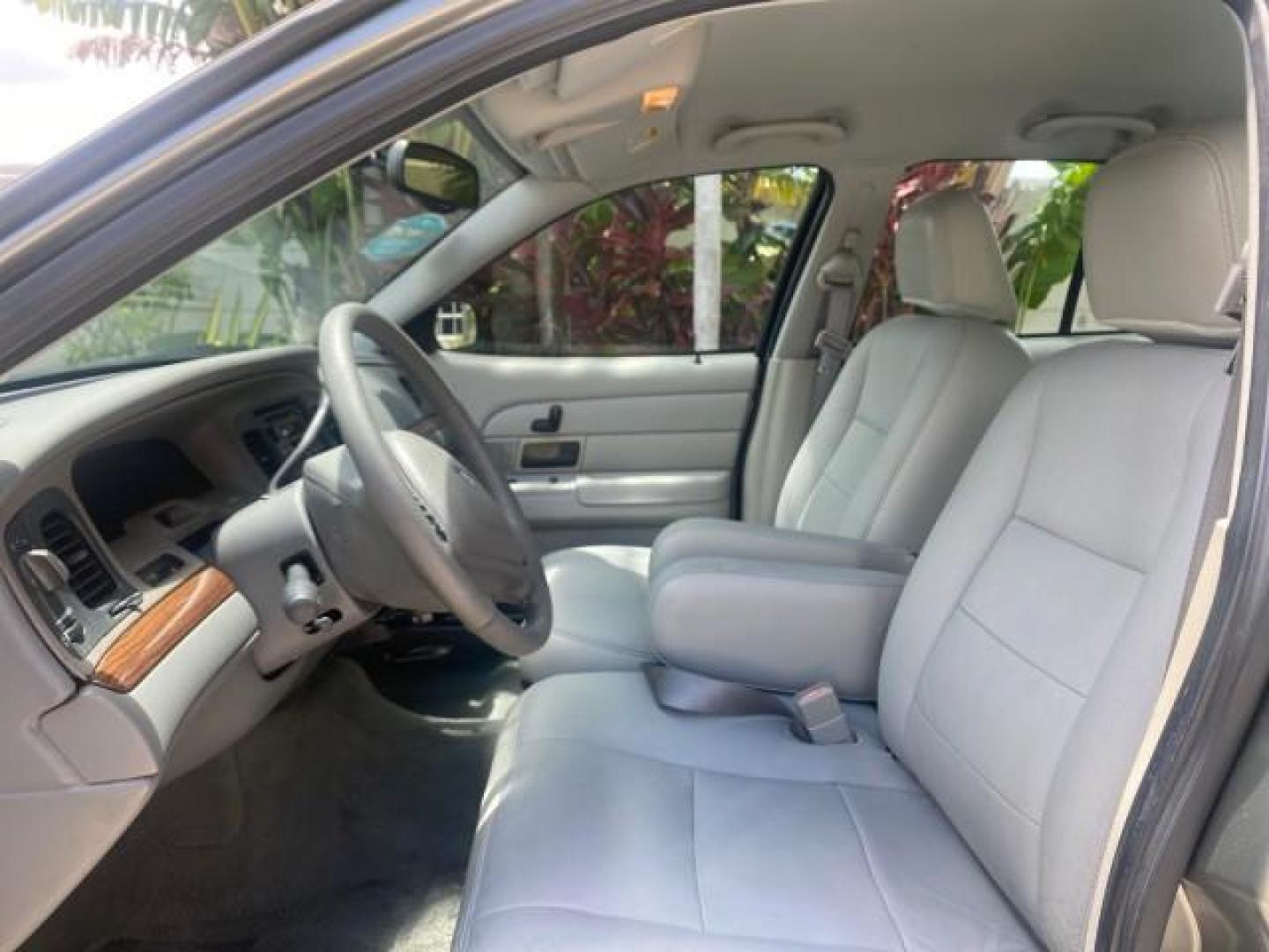 2004 Medium Titanium Metallic /Light Flint Ford Crown Victoria LX Sport LOW MILES 75,511 FL (2FAFP74W24X) with an 4.6L SEFI OHC V8 Engine engine, Automatic transmission, located at 4701 North Dixie Hwy, Pompano Beach, FL, 33064, (954) 422-2889, 26.240938, -80.123474 - OUR WEBPAGE FLORIDACARS1.COM HAS OVER 100 PHOTOS AND FREE CARFAX LINK 2004 FORD CROWN VICTORIA LX DUAL EXHAUST RARE FIND VIN: 2FAFP74W24X150704 2 F A F P 7 4 W 2 4 X 1 5 0 7 0 4 SEDAN 4 DR 4.6L V8 F GASOLINE REAR WHEEL DRIVE Top Features Alloy Wheels Leather Seats Basic Features ABS Brakes AM/FM Ste - Photo#33