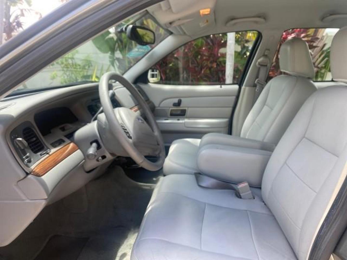 2004 Medium Titanium Metallic /Light Flint Ford Crown Victoria LX Sport LOW MILES 75,511 FL (2FAFP74W24X) with an 4.6L SEFI OHC V8 Engine engine, Automatic transmission, located at 4701 North Dixie Hwy, Pompano Beach, FL, 33064, (954) 422-2889, 26.240938, -80.123474 - OUR WEBPAGE FLORIDACARS1.COM HAS OVER 100 PHOTOS AND FREE CARFAX LINK 2004 FORD CROWN VICTORIA LX DUAL EXHAUST RARE FIND VIN: 2FAFP74W24X150704 2 F A F P 7 4 W 2 4 X 1 5 0 7 0 4 SEDAN 4 DR 4.6L V8 F GASOLINE REAR WHEEL DRIVE Top Features Alloy Wheels Leather Seats Basic Features ABS Brakes AM/FM Ste - Photo#34