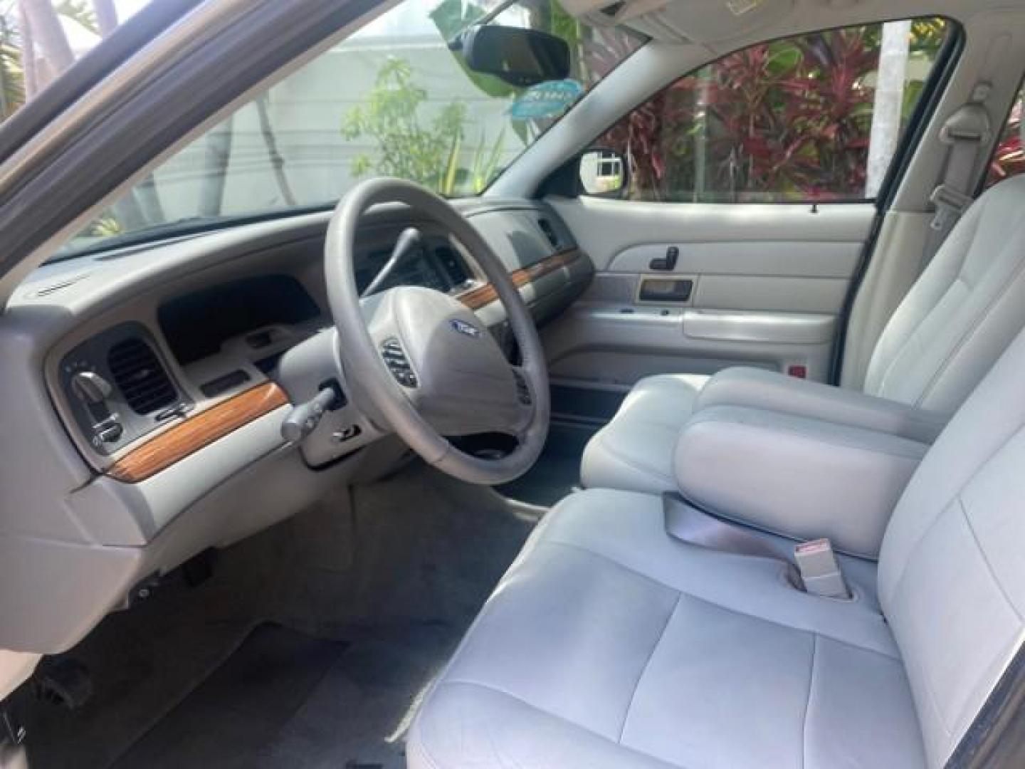 2004 Medium Titanium Metallic /Light Flint Ford Crown Victoria LX Sport LOW MILES 75,511 FL (2FAFP74W24X) with an 4.6L SEFI OHC V8 Engine engine, Automatic transmission, located at 4701 North Dixie Hwy, Pompano Beach, FL, 33064, (954) 422-2889, 26.240938, -80.123474 - OUR WEBPAGE FLORIDACARS1.COM HAS OVER 100 PHOTOS AND FREE CARFAX LINK 2004 FORD CROWN VICTORIA LX DUAL EXHAUST RARE FIND VIN: 2FAFP74W24X150704 2 F A F P 7 4 W 2 4 X 1 5 0 7 0 4 SEDAN 4 DR 4.6L V8 F GASOLINE REAR WHEEL DRIVE Top Features Alloy Wheels Leather Seats Basic Features ABS Brakes AM/FM Ste - Photo#35