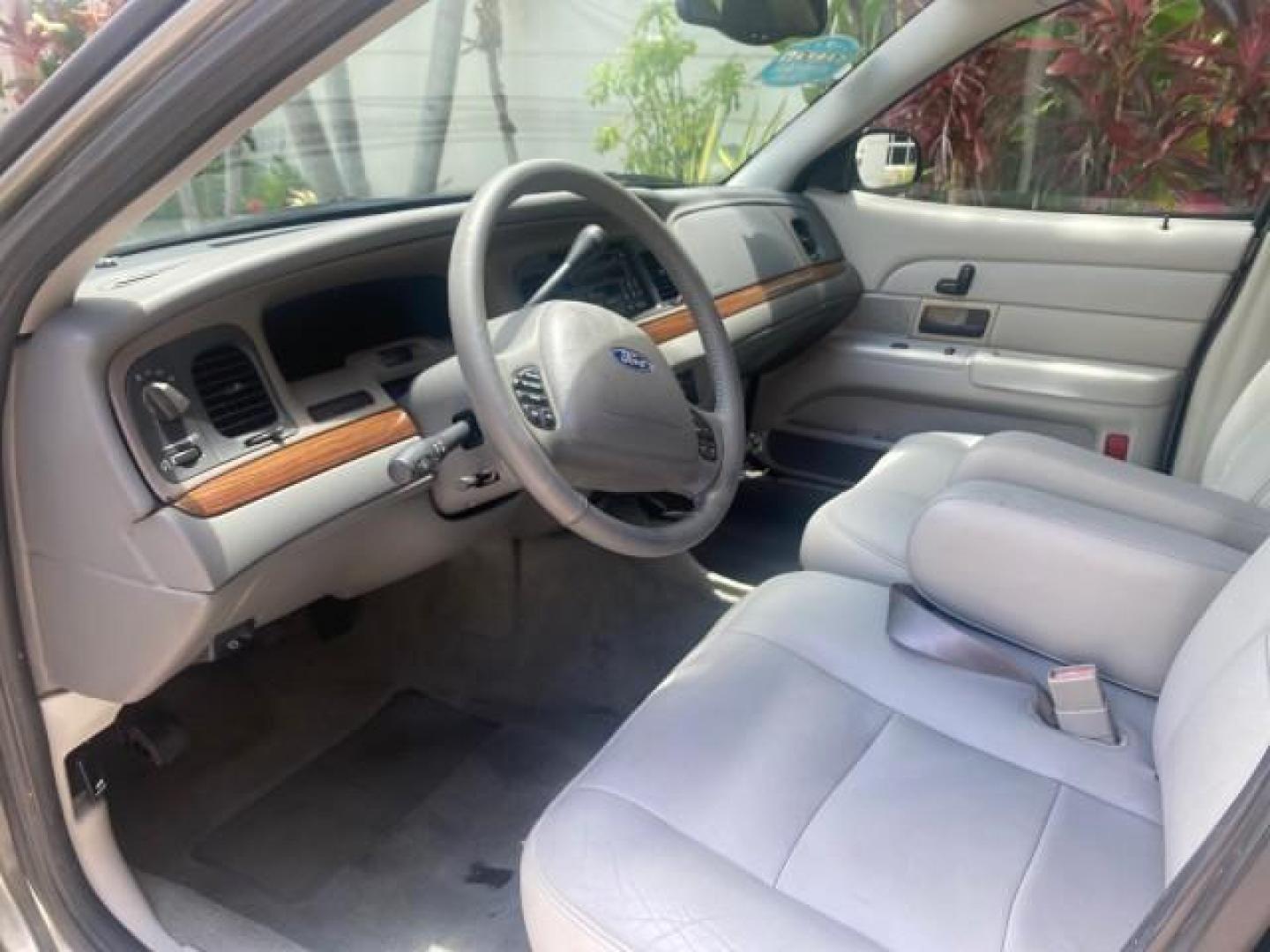 2004 Medium Titanium Metallic /Light Flint Ford Crown Victoria LX Sport LOW MILES 75,511 FL (2FAFP74W24X) with an 4.6L SEFI OHC V8 Engine engine, Automatic transmission, located at 4701 North Dixie Hwy, Pompano Beach, FL, 33064, (954) 422-2889, 26.240938, -80.123474 - OUR WEBPAGE FLORIDACARS1.COM HAS OVER 100 PHOTOS AND FREE CARFAX LINK 2004 FORD CROWN VICTORIA LX DUAL EXHAUST RARE FIND VIN: 2FAFP74W24X150704 2 F A F P 7 4 W 2 4 X 1 5 0 7 0 4 SEDAN 4 DR 4.6L V8 F GASOLINE REAR WHEEL DRIVE Top Features Alloy Wheels Leather Seats Basic Features ABS Brakes AM/FM Ste - Photo#36