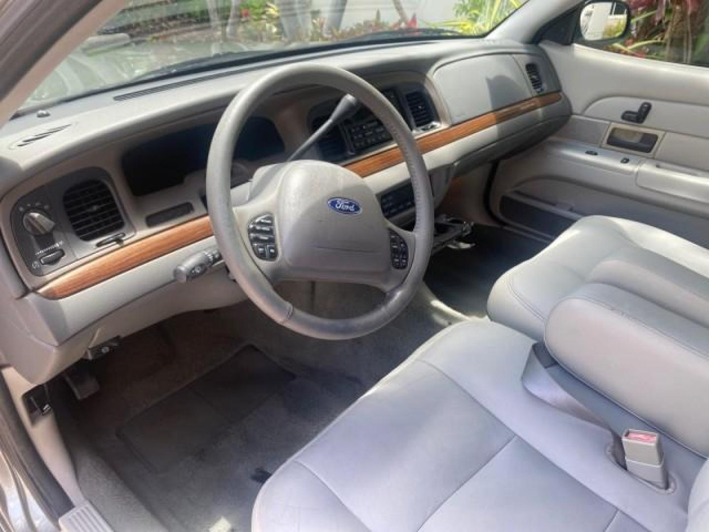 2004 Medium Titanium Metallic /Light Flint Ford Crown Victoria LX Sport LOW MILES 75,511 FL (2FAFP74W24X) with an 4.6L SEFI OHC V8 Engine engine, Automatic transmission, located at 4701 North Dixie Hwy, Pompano Beach, FL, 33064, (954) 422-2889, 26.240938, -80.123474 - OUR WEBPAGE FLORIDACARS1.COM HAS OVER 100 PHOTOS AND FREE CARFAX LINK 2004 FORD CROWN VICTORIA LX DUAL EXHAUST RARE FIND VIN: 2FAFP74W24X150704 2 F A F P 7 4 W 2 4 X 1 5 0 7 0 4 SEDAN 4 DR 4.6L V8 F GASOLINE REAR WHEEL DRIVE Top Features Alloy Wheels Leather Seats Basic Features ABS Brakes AM/FM Ste - Photo#37