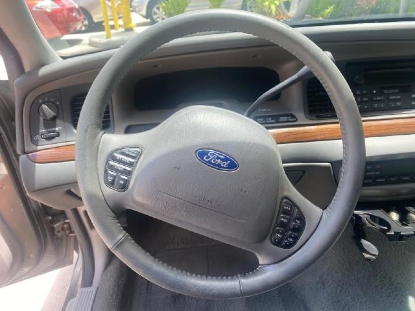 2004 Medium Titanium Metallic /Light Flint Ford Crown Victoria LX Sport LOW MILES 75,511 FL (2FAFP74W24X) with an 4.6L SEFI OHC V8 Engine engine, Automatic transmission, located at 4701 North Dixie Hwy, Pompano Beach, FL, 33064, (954) 422-2889, 26.240938, -80.123474 - OUR WEBPAGE FLORIDACARS1.COM HAS OVER 100 PHOTOS AND FREE CARFAX LINK 2004 FORD CROWN VICTORIA LX DUAL EXHAUST RARE FIND VIN: 2FAFP74W24X150704 2 F A F P 7 4 W 2 4 X 1 5 0 7 0 4 SEDAN 4 DR 4.6L V8 F GASOLINE REAR WHEEL DRIVE Top Features Alloy Wheels Leather Seats Basic Features ABS Brakes AM/FM Ste - Photo#38