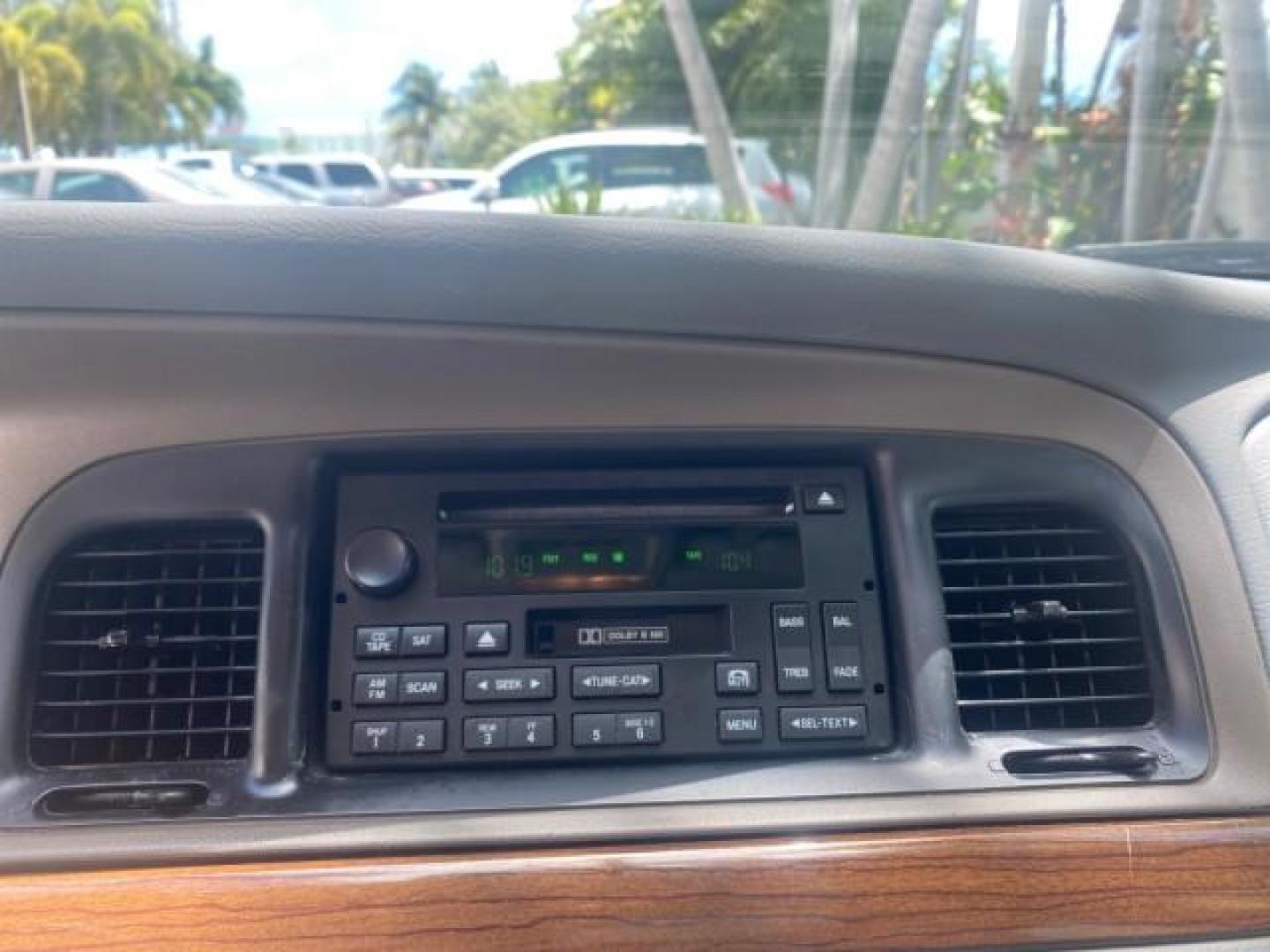 2004 Medium Titanium Metallic /Light Flint Ford Crown Victoria LX Sport LOW MILES 75,511 FL (2FAFP74W24X) with an 4.6L SEFI OHC V8 Engine engine, Automatic transmission, located at 4701 North Dixie Hwy, Pompano Beach, FL, 33064, (954) 422-2889, 26.240938, -80.123474 - OUR WEBPAGE FLORIDACARS1.COM HAS OVER 100 PHOTOS AND FREE CARFAX LINK 2004 FORD CROWN VICTORIA LX DUAL EXHAUST RARE FIND VIN: 2FAFP74W24X150704 2 F A F P 7 4 W 2 4 X 1 5 0 7 0 4 SEDAN 4 DR 4.6L V8 F GASOLINE REAR WHEEL DRIVE Top Features Alloy Wheels Leather Seats Basic Features ABS Brakes AM/FM Ste - Photo#46