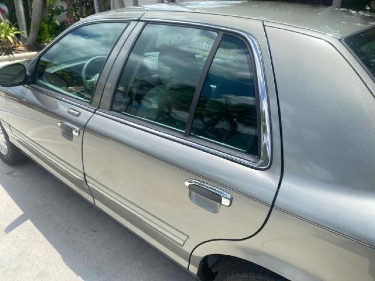 2004 Medium Titanium Metallic /Light Flint Ford Crown Victoria LX Sport LOW MILES 75,511 FL (2FAFP74W24X) with an 4.6L SEFI OHC V8 Engine engine, Automatic transmission, located at 4701 North Dixie Hwy, Pompano Beach, FL, 33064, (954) 422-2889, 26.240938, -80.123474 - OUR WEBPAGE FLORIDACARS1.COM HAS OVER 100 PHOTOS AND FREE CARFAX LINK 2004 FORD CROWN VICTORIA LX DUAL EXHAUST RARE FIND VIN: 2FAFP74W24X150704 2 F A F P 7 4 W 2 4 X 1 5 0 7 0 4 SEDAN 4 DR 4.6L V8 F GASOLINE REAR WHEEL DRIVE Top Features Alloy Wheels Leather Seats Basic Features ABS Brakes AM/FM Ste - Photo#54
