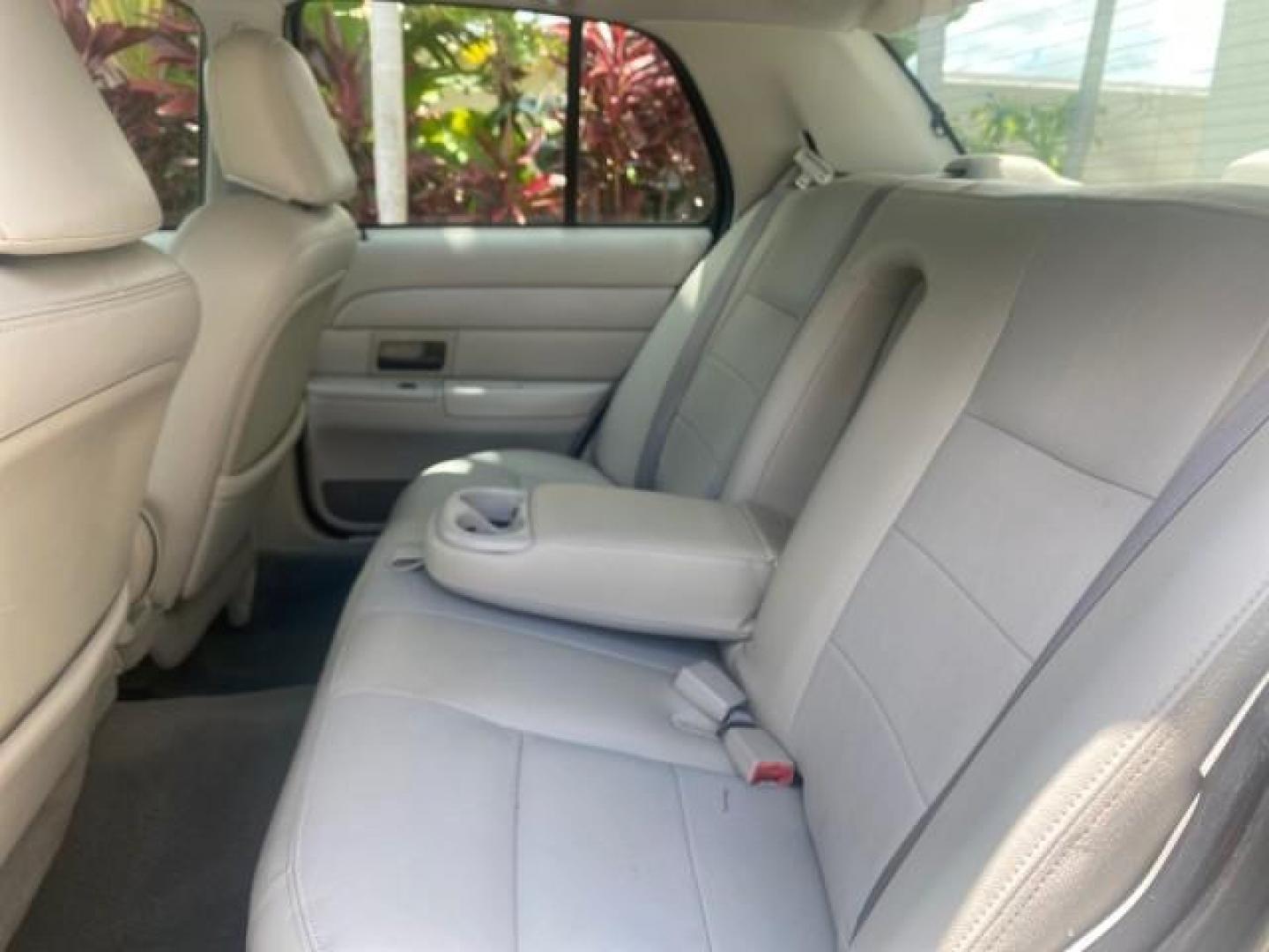 2004 Medium Titanium Metallic /Light Flint Ford Crown Victoria LX Sport LOW MILES 75,511 FL (2FAFP74W24X) with an 4.6L SEFI OHC V8 Engine engine, Automatic transmission, located at 4701 North Dixie Hwy, Pompano Beach, FL, 33064, (954) 422-2889, 26.240938, -80.123474 - OUR WEBPAGE FLORIDACARS1.COM HAS OVER 100 PHOTOS AND FREE CARFAX LINK 2004 FORD CROWN VICTORIA LX DUAL EXHAUST RARE FIND VIN: 2FAFP74W24X150704 2 F A F P 7 4 W 2 4 X 1 5 0 7 0 4 SEDAN 4 DR 4.6L V8 F GASOLINE REAR WHEEL DRIVE Top Features Alloy Wheels Leather Seats Basic Features ABS Brakes AM/FM Ste - Photo#57