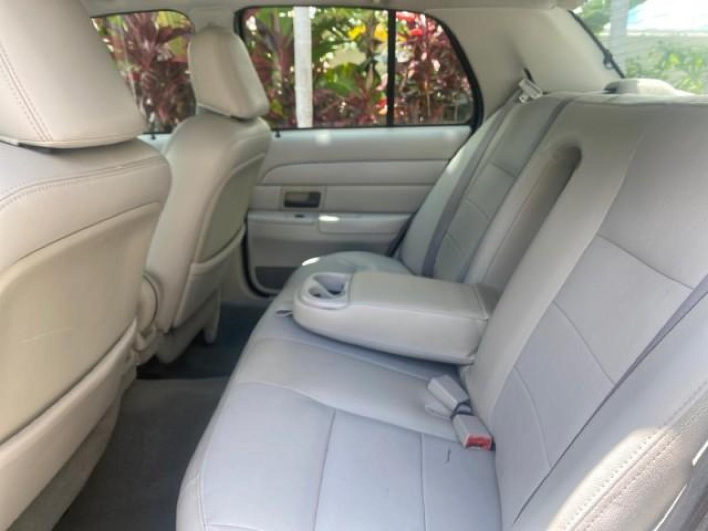 2004 Medium Titanium Metallic /Light Flint Ford Crown Victoria LX Sport LOW MILES 75,511 FL (2FAFP74W24X) with an 4.6L SEFI OHC V8 Engine engine, Automatic transmission, located at 4701 North Dixie Hwy, Pompano Beach, FL, 33064, (954) 422-2889, 26.240938, -80.123474 - OUR WEBPAGE FLORIDACARS1.COM HAS OVER 100 PHOTOS AND FREE CARFAX LINK 2004 FORD CROWN VICTORIA LX DUAL EXHAUST RARE FIND VIN: 2FAFP74W24X150704 2 F A F P 7 4 W 2 4 X 1 5 0 7 0 4 SEDAN 4 DR 4.6L V8 F GASOLINE REAR WHEEL DRIVE Top Features Alloy Wheels Leather Seats Basic Features ABS Brakes AM/FM Ste - Photo#58