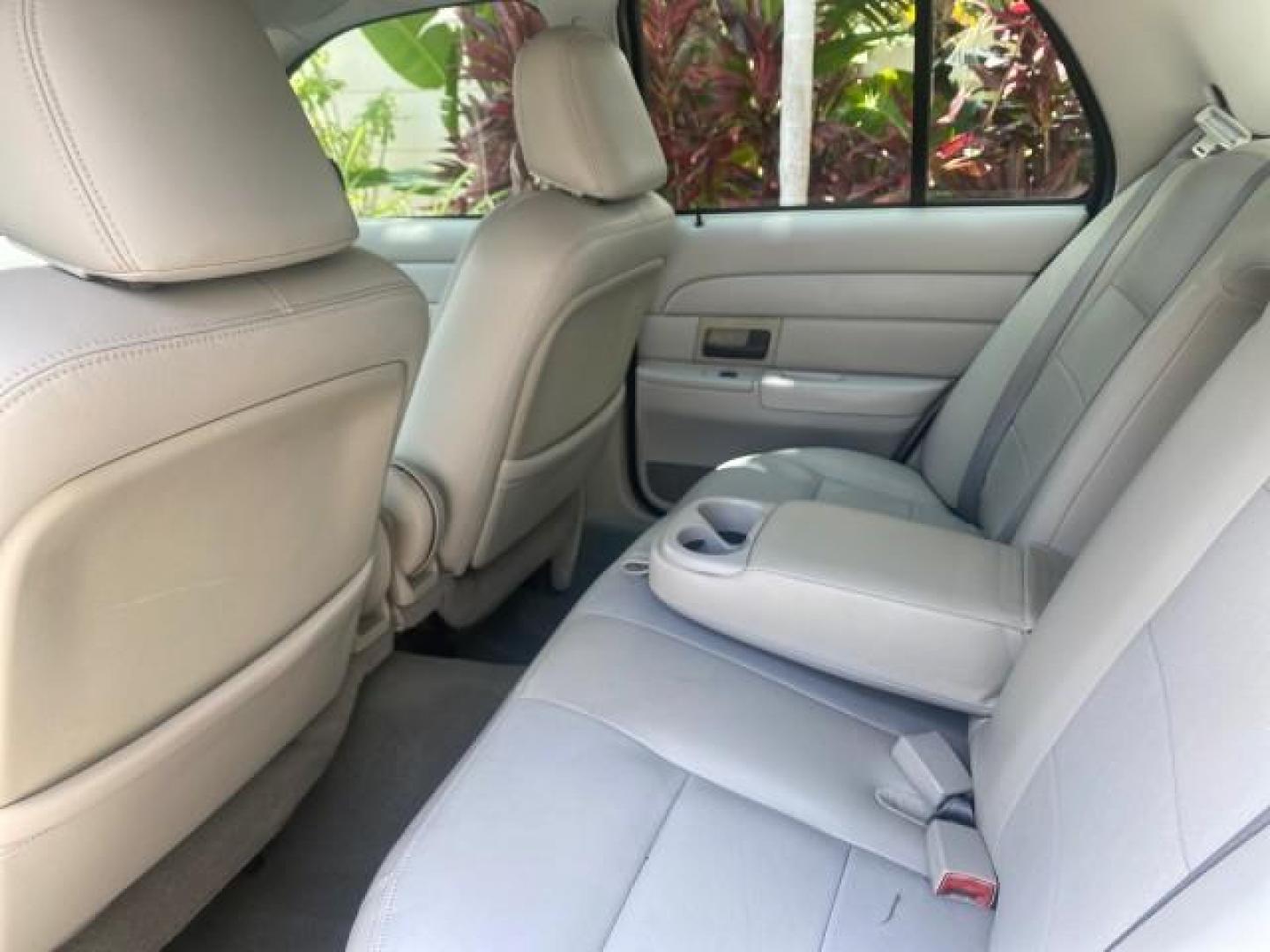 2004 Medium Titanium Metallic /Light Flint Ford Crown Victoria LX Sport LOW MILES 75,511 FL (2FAFP74W24X) with an 4.6L SEFI OHC V8 Engine engine, Automatic transmission, located at 4701 North Dixie Hwy, Pompano Beach, FL, 33064, (954) 422-2889, 26.240938, -80.123474 - OUR WEBPAGE FLORIDACARS1.COM HAS OVER 100 PHOTOS AND FREE CARFAX LINK 2004 FORD CROWN VICTORIA LX DUAL EXHAUST RARE FIND VIN: 2FAFP74W24X150704 2 F A F P 7 4 W 2 4 X 1 5 0 7 0 4 SEDAN 4 DR 4.6L V8 F GASOLINE REAR WHEEL DRIVE Top Features Alloy Wheels Leather Seats Basic Features ABS Brakes AM/FM Ste - Photo#59