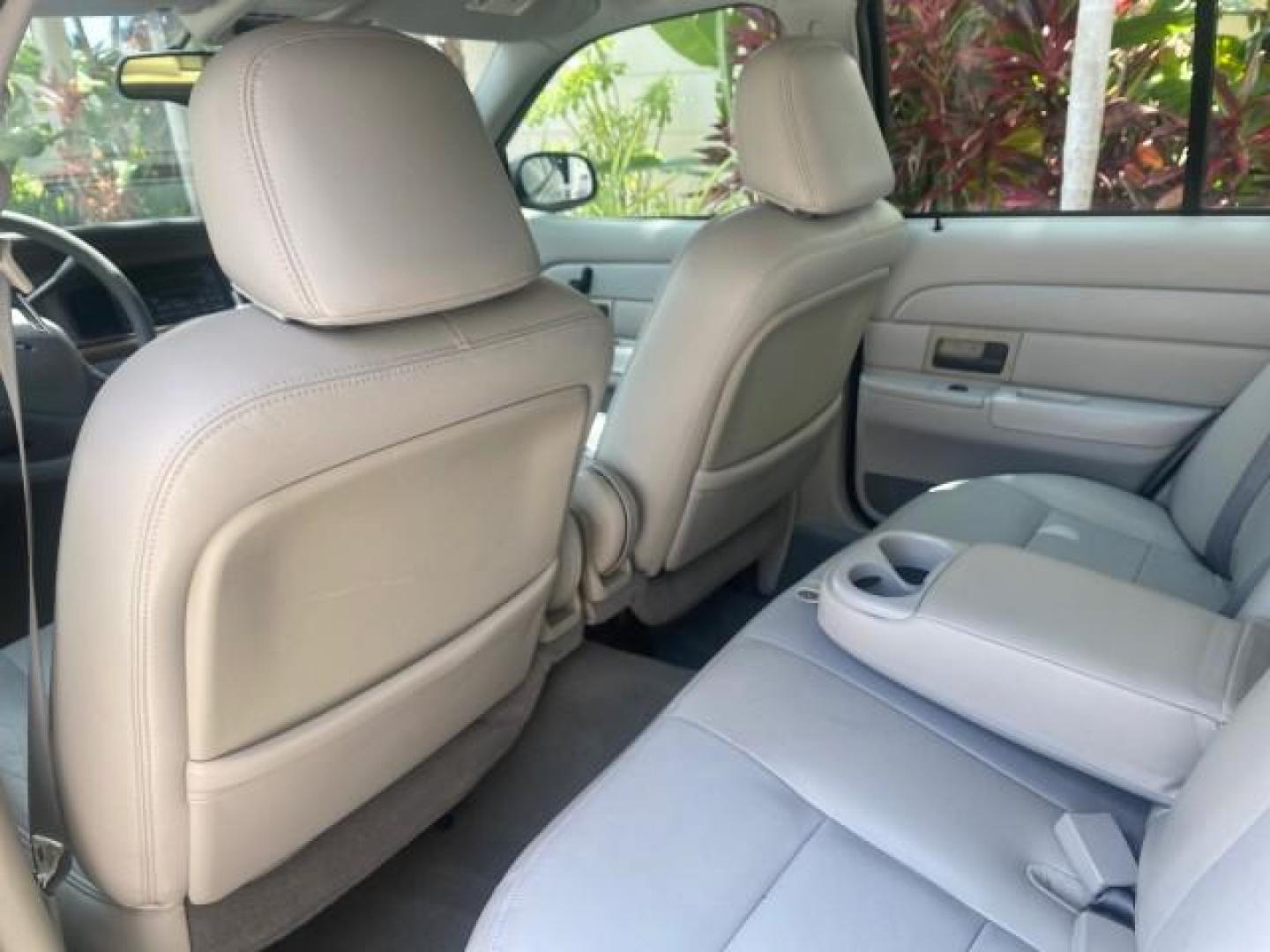 2004 Medium Titanium Metallic /Light Flint Ford Crown Victoria LX Sport LOW MILES 75,511 FL (2FAFP74W24X) with an 4.6L SEFI OHC V8 Engine engine, Automatic transmission, located at 4701 North Dixie Hwy, Pompano Beach, FL, 33064, (954) 422-2889, 26.240938, -80.123474 - OUR WEBPAGE FLORIDACARS1.COM HAS OVER 100 PHOTOS AND FREE CARFAX LINK 2004 FORD CROWN VICTORIA LX DUAL EXHAUST RARE FIND VIN: 2FAFP74W24X150704 2 F A F P 7 4 W 2 4 X 1 5 0 7 0 4 SEDAN 4 DR 4.6L V8 F GASOLINE REAR WHEEL DRIVE Top Features Alloy Wheels Leather Seats Basic Features ABS Brakes AM/FM Ste - Photo#60