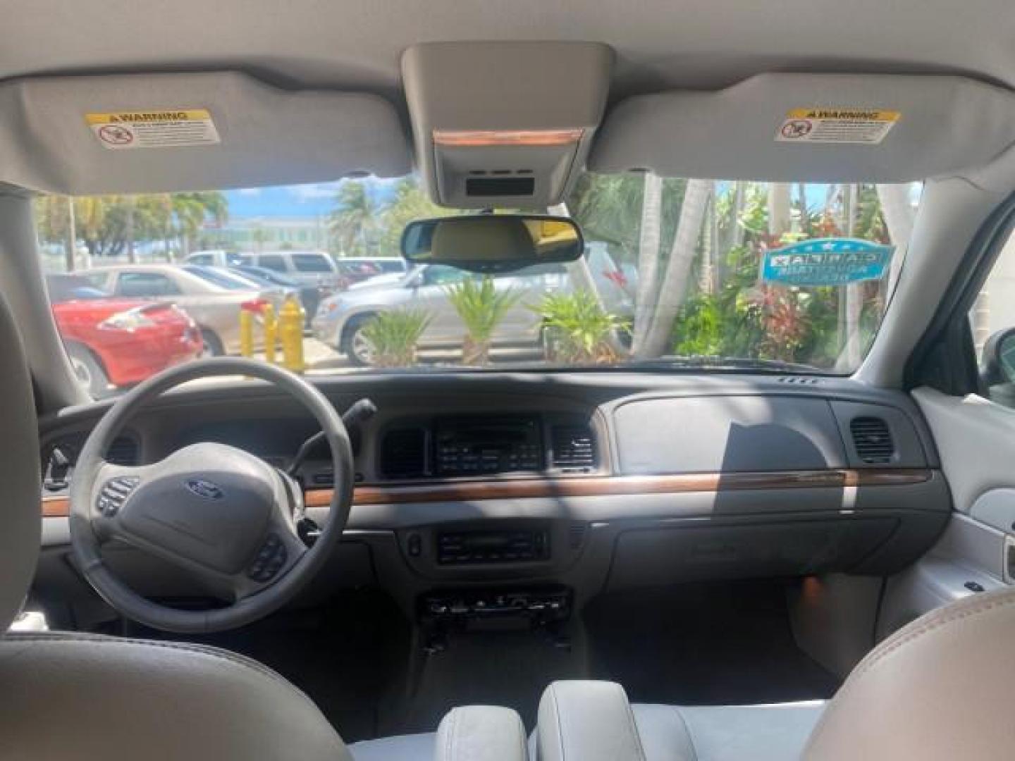 2004 Medium Titanium Metallic /Light Flint Ford Crown Victoria LX Sport LOW MILES 75,511 FL (2FAFP74W24X) with an 4.6L SEFI OHC V8 Engine engine, Automatic transmission, located at 4701 North Dixie Hwy, Pompano Beach, FL, 33064, (954) 422-2889, 26.240938, -80.123474 - OUR WEBPAGE FLORIDACARS1.COM HAS OVER 100 PHOTOS AND FREE CARFAX LINK 2004 FORD CROWN VICTORIA LX DUAL EXHAUST RARE FIND VIN: 2FAFP74W24X150704 2 F A F P 7 4 W 2 4 X 1 5 0 7 0 4 SEDAN 4 DR 4.6L V8 F GASOLINE REAR WHEEL DRIVE Top Features Alloy Wheels Leather Seats Basic Features ABS Brakes AM/FM Ste - Photo#61