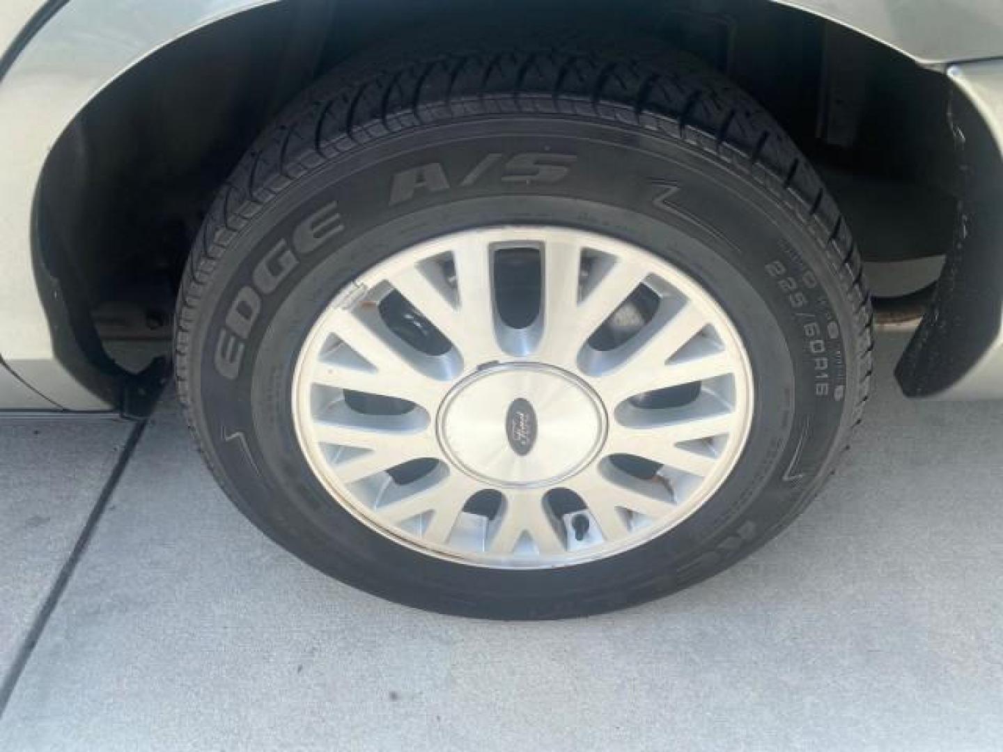 2004 Medium Titanium Metallic /Light Flint Ford Crown Victoria LX Sport LOW MILES 75,511 FL (2FAFP74W24X) with an 4.6L SEFI OHC V8 Engine engine, Automatic transmission, located at 4701 North Dixie Hwy, Pompano Beach, FL, 33064, (954) 422-2889, 26.240938, -80.123474 - OUR WEBPAGE FLORIDACARS1.COM HAS OVER 100 PHOTOS AND FREE CARFAX LINK 2004 FORD CROWN VICTORIA LX DUAL EXHAUST RARE FIND VIN: 2FAFP74W24X150704 2 F A F P 7 4 W 2 4 X 1 5 0 7 0 4 SEDAN 4 DR 4.6L V8 F GASOLINE REAR WHEEL DRIVE Top Features Alloy Wheels Leather Seats Basic Features ABS Brakes AM/FM Ste - Photo#65