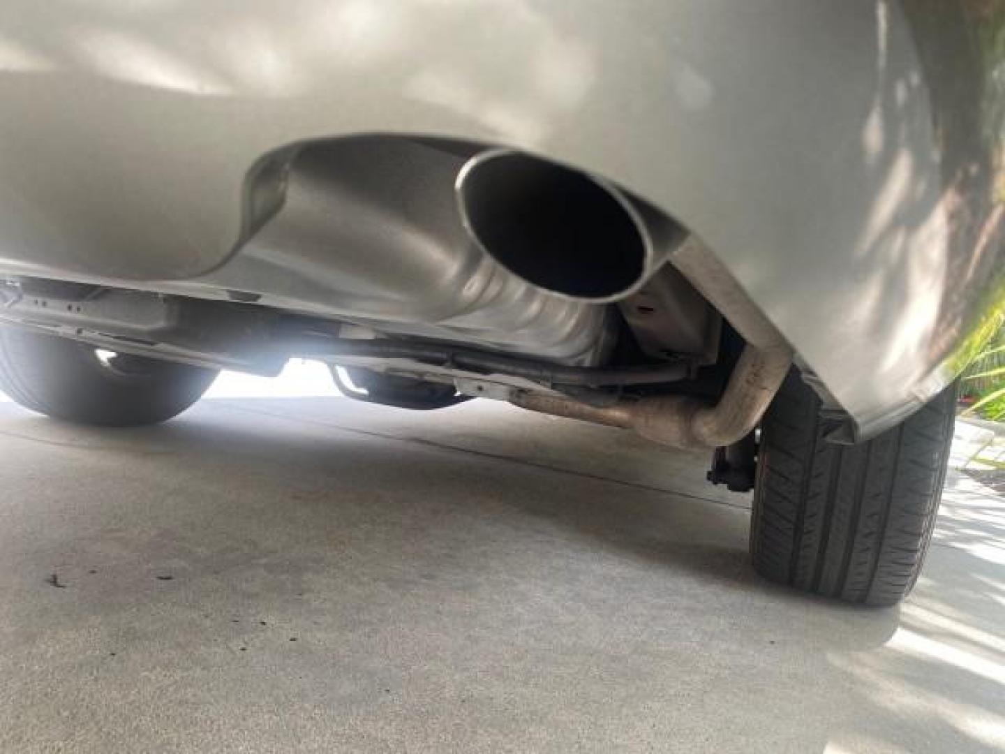 2004 Medium Titanium Metallic /Light Flint Ford Crown Victoria LX Sport LOW MILES 75,511 FL (2FAFP74W24X) with an 4.6L SEFI OHC V8 Engine engine, Automatic transmission, located at 4701 North Dixie Hwy, Pompano Beach, FL, 33064, (954) 422-2889, 26.240938, -80.123474 - OUR WEBPAGE FLORIDACARS1.COM HAS OVER 100 PHOTOS AND FREE CARFAX LINK 2004 FORD CROWN VICTORIA LX DUAL EXHAUST RARE FIND VIN: 2FAFP74W24X150704 2 F A F P 7 4 W 2 4 X 1 5 0 7 0 4 SEDAN 4 DR 4.6L V8 F GASOLINE REAR WHEEL DRIVE Top Features Alloy Wheels Leather Seats Basic Features ABS Brakes AM/FM Ste - Photo#77