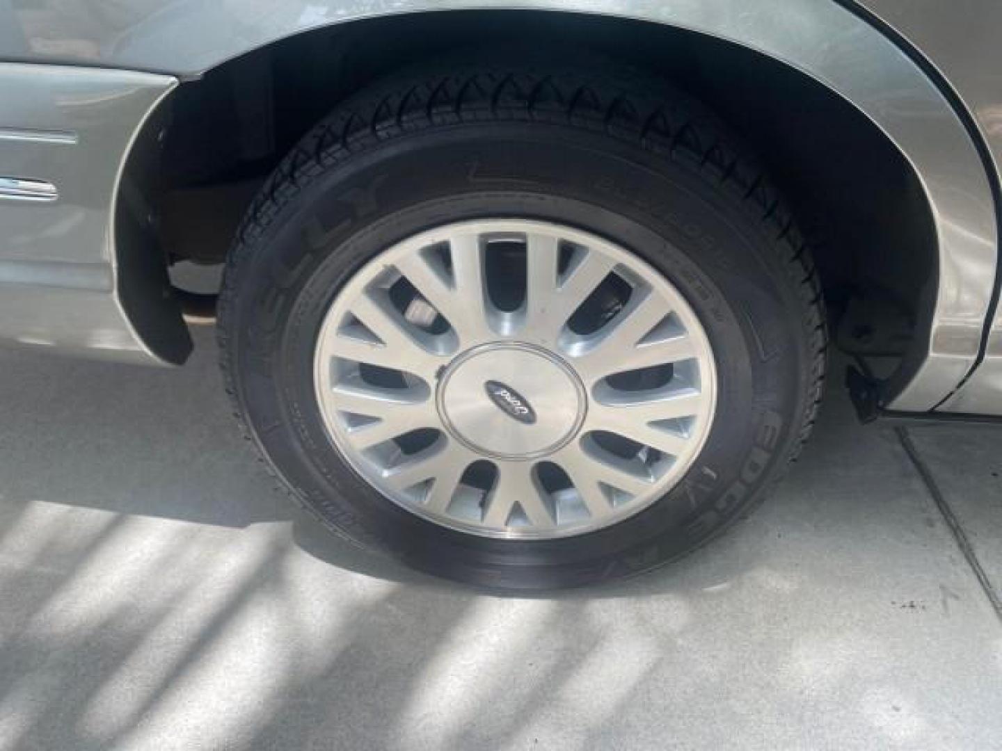 2004 Medium Titanium Metallic /Light Flint Ford Crown Victoria LX Sport LOW MILES 75,511 FL (2FAFP74W24X) with an 4.6L SEFI OHC V8 Engine engine, Automatic transmission, located at 4701 North Dixie Hwy, Pompano Beach, FL, 33064, (954) 422-2889, 26.240938, -80.123474 - OUR WEBPAGE FLORIDACARS1.COM HAS OVER 100 PHOTOS AND FREE CARFAX LINK 2004 FORD CROWN VICTORIA LX DUAL EXHAUST RARE FIND VIN: 2FAFP74W24X150704 2 F A F P 7 4 W 2 4 X 1 5 0 7 0 4 SEDAN 4 DR 4.6L V8 F GASOLINE REAR WHEEL DRIVE Top Features Alloy Wheels Leather Seats Basic Features ABS Brakes AM/FM Ste - Photo#79