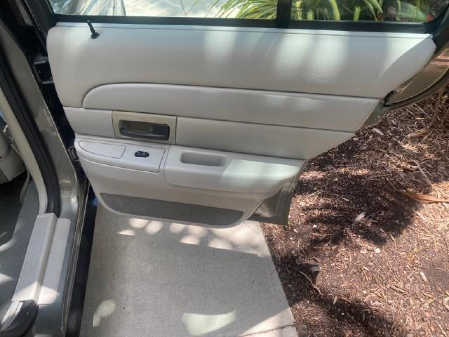 2004 Medium Titanium Metallic /Light Flint Ford Crown Victoria LX Sport LOW MILES 75,511 FL (2FAFP74W24X) with an 4.6L SEFI OHC V8 Engine engine, Automatic transmission, located at 4701 North Dixie Hwy, Pompano Beach, FL, 33064, (954) 422-2889, 26.240938, -80.123474 - OUR WEBPAGE FLORIDACARS1.COM HAS OVER 100 PHOTOS AND FREE CARFAX LINK 2004 FORD CROWN VICTORIA LX DUAL EXHAUST RARE FIND VIN: 2FAFP74W24X150704 2 F A F P 7 4 W 2 4 X 1 5 0 7 0 4 SEDAN 4 DR 4.6L V8 F GASOLINE REAR WHEEL DRIVE Top Features Alloy Wheels Leather Seats Basic Features ABS Brakes AM/FM Ste - Photo#83