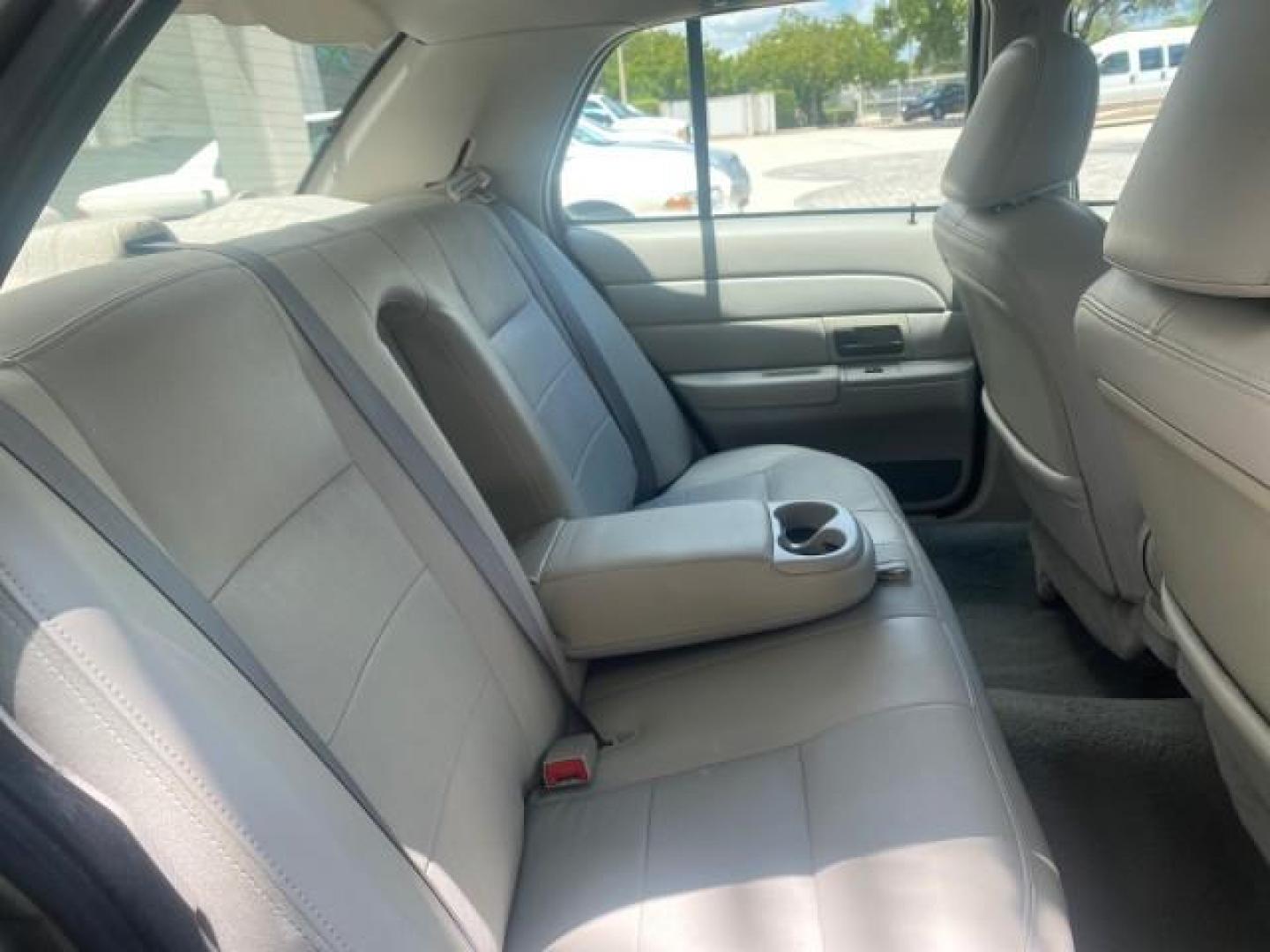 2004 Medium Titanium Metallic /Light Flint Ford Crown Victoria LX Sport LOW MILES 75,511 FL (2FAFP74W24X) with an 4.6L SEFI OHC V8 Engine engine, Automatic transmission, located at 4701 North Dixie Hwy, Pompano Beach, FL, 33064, (954) 422-2889, 26.240938, -80.123474 - OUR WEBPAGE FLORIDACARS1.COM HAS OVER 100 PHOTOS AND FREE CARFAX LINK 2004 FORD CROWN VICTORIA LX DUAL EXHAUST RARE FIND VIN: 2FAFP74W24X150704 2 F A F P 7 4 W 2 4 X 1 5 0 7 0 4 SEDAN 4 DR 4.6L V8 F GASOLINE REAR WHEEL DRIVE Top Features Alloy Wheels Leather Seats Basic Features ABS Brakes AM/FM Ste - Photo#84