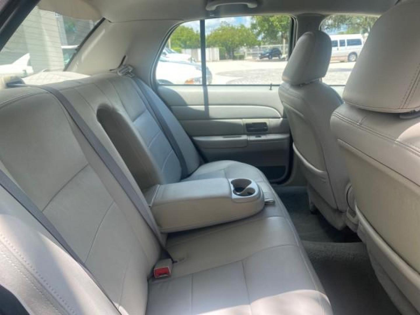 2004 Medium Titanium Metallic /Light Flint Ford Crown Victoria LX Sport LOW MILES 75,511 FL (2FAFP74W24X) with an 4.6L SEFI OHC V8 Engine engine, Automatic transmission, located at 4701 North Dixie Hwy, Pompano Beach, FL, 33064, (954) 422-2889, 26.240938, -80.123474 - OUR WEBPAGE FLORIDACARS1.COM HAS OVER 100 PHOTOS AND FREE CARFAX LINK 2004 FORD CROWN VICTORIA LX DUAL EXHAUST RARE FIND VIN: 2FAFP74W24X150704 2 F A F P 7 4 W 2 4 X 1 5 0 7 0 4 SEDAN 4 DR 4.6L V8 F GASOLINE REAR WHEEL DRIVE Top Features Alloy Wheels Leather Seats Basic Features ABS Brakes AM/FM Ste - Photo#85