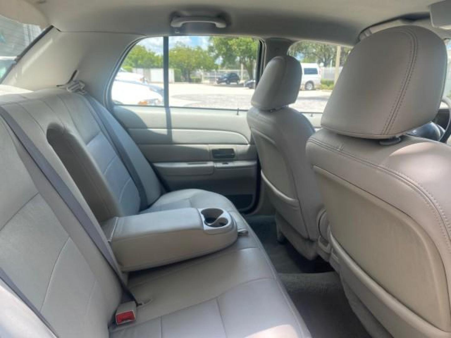 2004 Medium Titanium Metallic /Light Flint Ford Crown Victoria LX Sport LOW MILES 75,511 FL (2FAFP74W24X) with an 4.6L SEFI OHC V8 Engine engine, Automatic transmission, located at 4701 North Dixie Hwy, Pompano Beach, FL, 33064, (954) 422-2889, 26.240938, -80.123474 - OUR WEBPAGE FLORIDACARS1.COM HAS OVER 100 PHOTOS AND FREE CARFAX LINK 2004 FORD CROWN VICTORIA LX DUAL EXHAUST RARE FIND VIN: 2FAFP74W24X150704 2 F A F P 7 4 W 2 4 X 1 5 0 7 0 4 SEDAN 4 DR 4.6L V8 F GASOLINE REAR WHEEL DRIVE Top Features Alloy Wheels Leather Seats Basic Features ABS Brakes AM/FM Ste - Photo#86