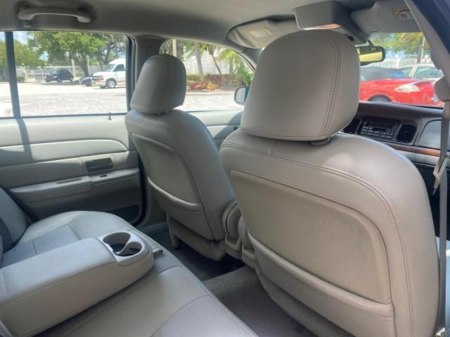 2004 Medium Titanium Metallic /Light Flint Ford Crown Victoria LX Sport LOW MILES 75,511 FL (2FAFP74W24X) with an 4.6L SEFI OHC V8 Engine engine, Automatic transmission, located at 4701 North Dixie Hwy, Pompano Beach, FL, 33064, (954) 422-2889, 26.240938, -80.123474 - OUR WEBPAGE FLORIDACARS1.COM HAS OVER 100 PHOTOS AND FREE CARFAX LINK 2004 FORD CROWN VICTORIA LX DUAL EXHAUST RARE FIND VIN: 2FAFP74W24X150704 2 F A F P 7 4 W 2 4 X 1 5 0 7 0 4 SEDAN 4 DR 4.6L V8 F GASOLINE REAR WHEEL DRIVE Top Features Alloy Wheels Leather Seats Basic Features ABS Brakes AM/FM Ste - Photo#87