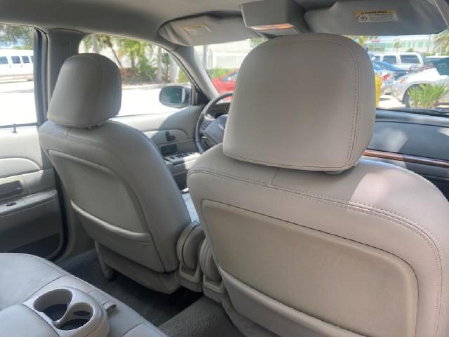 2004 Medium Titanium Metallic /Light Flint Ford Crown Victoria LX Sport LOW MILES 75,511 FL (2FAFP74W24X) with an 4.6L SEFI OHC V8 Engine engine, Automatic transmission, located at 4701 North Dixie Hwy, Pompano Beach, FL, 33064, (954) 422-2889, 26.240938, -80.123474 - OUR WEBPAGE FLORIDACARS1.COM HAS OVER 100 PHOTOS AND FREE CARFAX LINK 2004 FORD CROWN VICTORIA LX DUAL EXHAUST RARE FIND VIN: 2FAFP74W24X150704 2 F A F P 7 4 W 2 4 X 1 5 0 7 0 4 SEDAN 4 DR 4.6L V8 F GASOLINE REAR WHEEL DRIVE Top Features Alloy Wheels Leather Seats Basic Features ABS Brakes AM/FM Ste - Photo#88