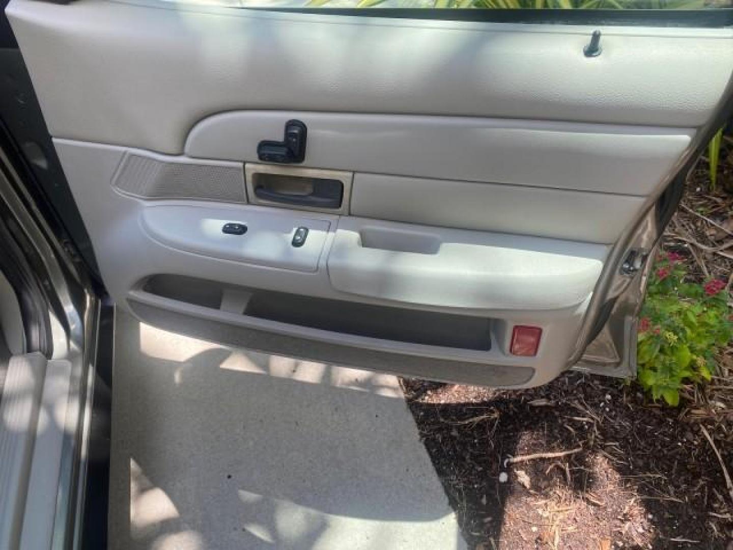 2004 Medium Titanium Metallic /Light Flint Ford Crown Victoria LX Sport LOW MILES 75,511 FL (2FAFP74W24X) with an 4.6L SEFI OHC V8 Engine engine, Automatic transmission, located at 4701 North Dixie Hwy, Pompano Beach, FL, 33064, (954) 422-2889, 26.240938, -80.123474 - OUR WEBPAGE FLORIDACARS1.COM HAS OVER 100 PHOTOS AND FREE CARFAX LINK 2004 FORD CROWN VICTORIA LX DUAL EXHAUST RARE FIND VIN: 2FAFP74W24X150704 2 F A F P 7 4 W 2 4 X 1 5 0 7 0 4 SEDAN 4 DR 4.6L V8 F GASOLINE REAR WHEEL DRIVE Top Features Alloy Wheels Leather Seats Basic Features ABS Brakes AM/FM Ste - Photo#91