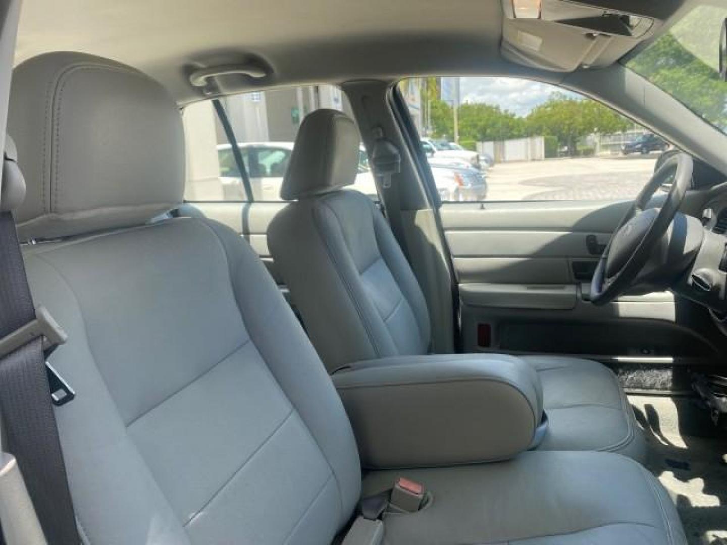 2004 Medium Titanium Metallic /Light Flint Ford Crown Victoria LX Sport LOW MILES 75,511 FL (2FAFP74W24X) with an 4.6L SEFI OHC V8 Engine engine, Automatic transmission, located at 4701 North Dixie Hwy, Pompano Beach, FL, 33064, (954) 422-2889, 26.240938, -80.123474 - OUR WEBPAGE FLORIDACARS1.COM HAS OVER 100 PHOTOS AND FREE CARFAX LINK 2004 FORD CROWN VICTORIA LX DUAL EXHAUST RARE FIND VIN: 2FAFP74W24X150704 2 F A F P 7 4 W 2 4 X 1 5 0 7 0 4 SEDAN 4 DR 4.6L V8 F GASOLINE REAR WHEEL DRIVE Top Features Alloy Wheels Leather Seats Basic Features ABS Brakes AM/FM Ste - Photo#92